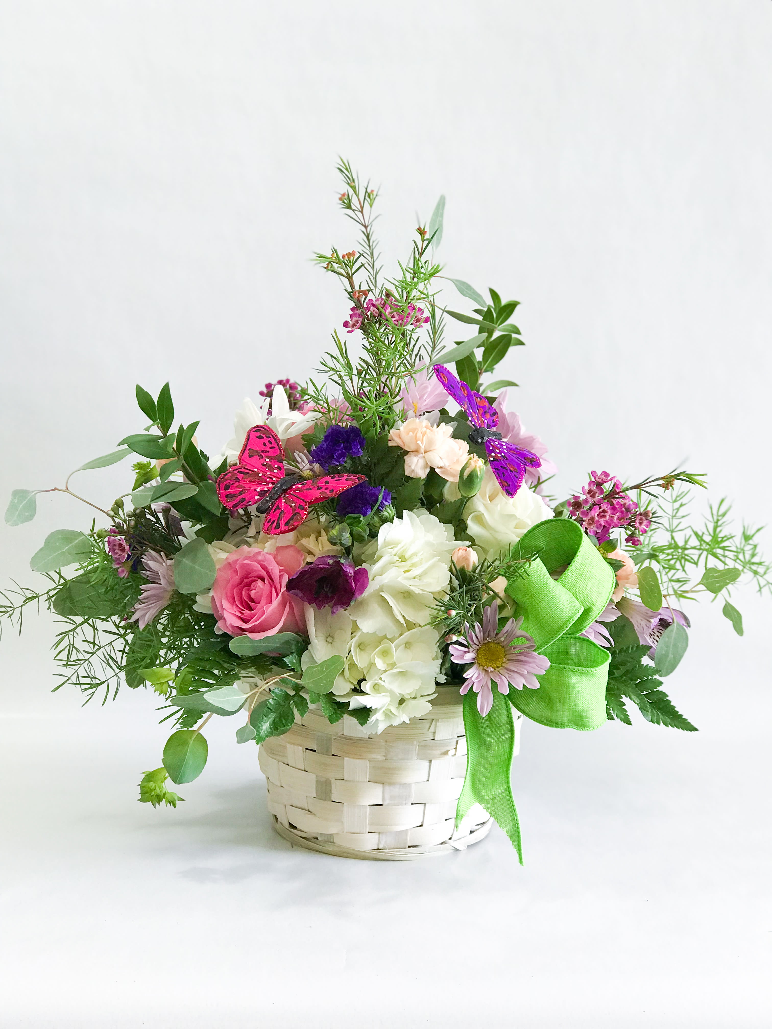 My Garden Bouquet by Barb's Flowers - A low bowl design with a nice mixture of seasonal flowers and butterflies adds that nice touch.  Sure to please that gardener.