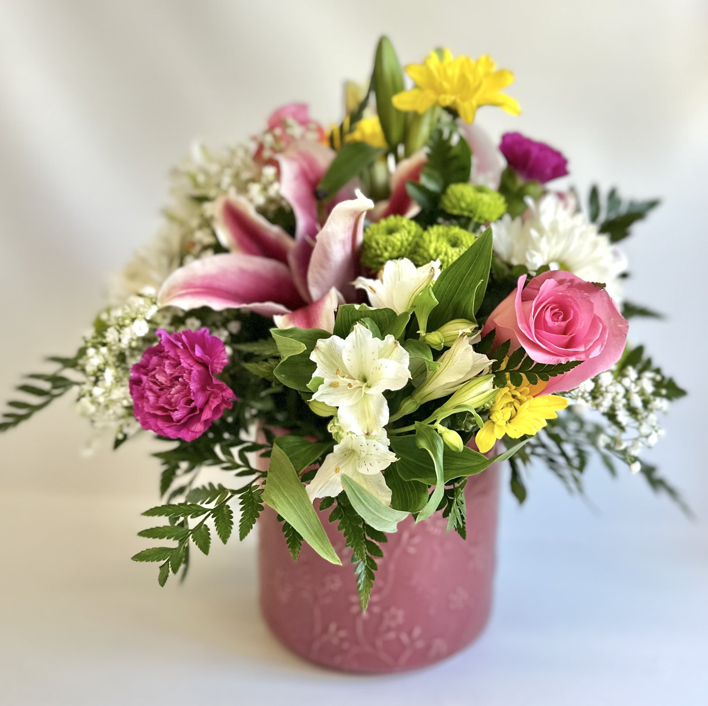 Mama Mia by Barb’s Flowers - A fun mixed bouquet in a large ceramic container. 