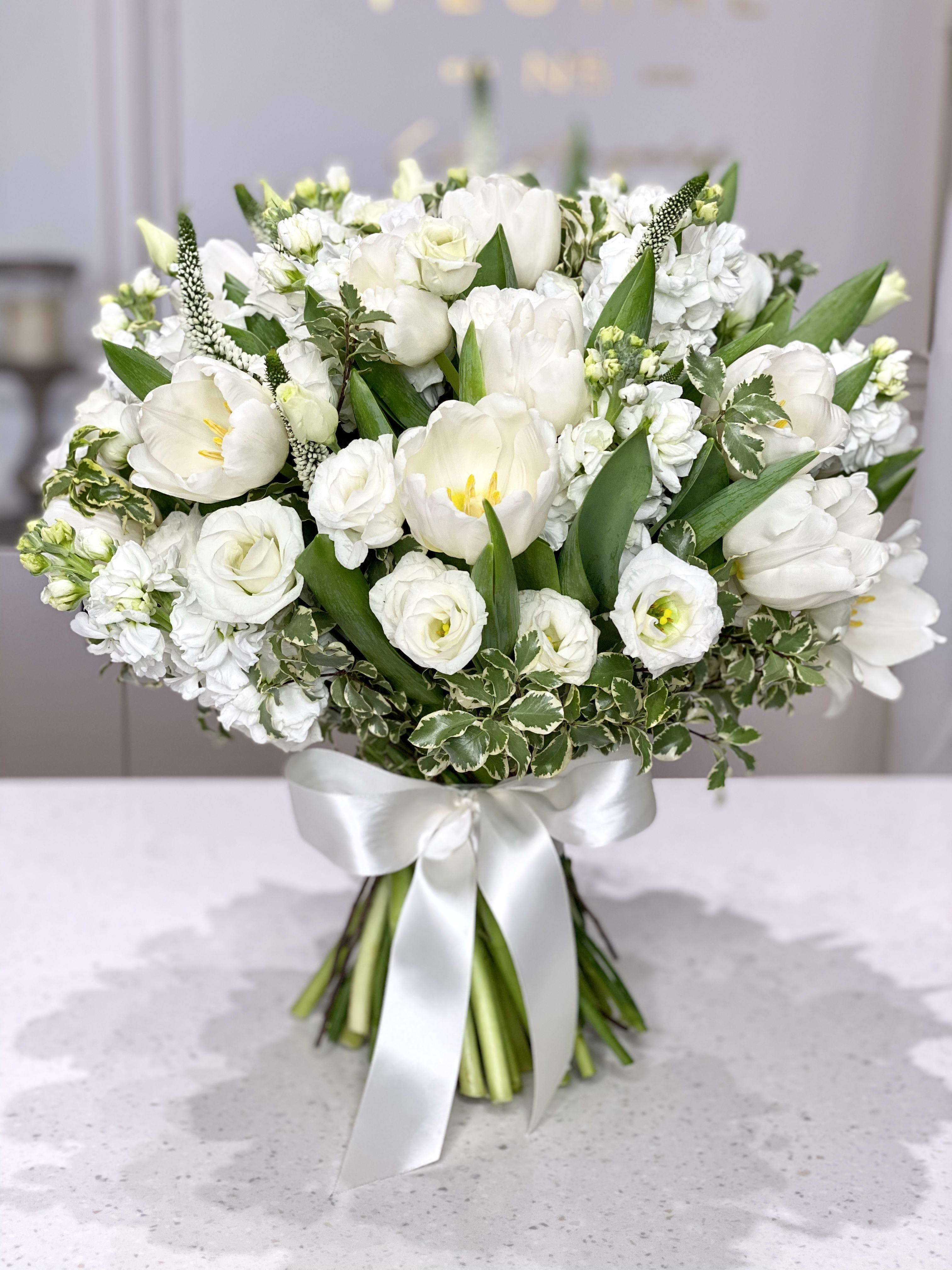 No.11-Traditional white hand bouquet No.11-Traditional white hand bouquet - A bright white hand bouquet with Tulips, Matiolas, Lisianthuses, Veronica and other flowers to complete the composition. This mixed flower bouquet is a heartfelt expression of life’s most meaningful moments—crafted with care by our dedicated florist in Studio City. Each stem is thoughtfully selected to create a vibrant blend of color, fragrance, and feeling. More than just flowers, it's a gesture that speaks volumes. With same day flower delivery, your sentiment arrives right on time, beautifully delivered and impossible to forget.