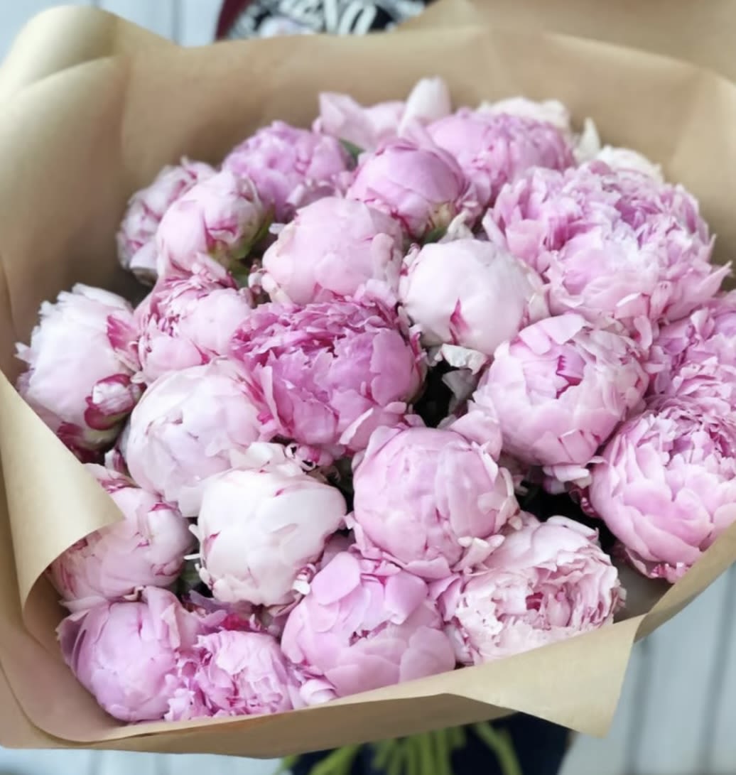 Blush Peony Bouquet - Peonies are the ultimate symbol of romance, grace, and natural luxury. This bouquet showcases their lush, full blooms in soft pastel tones — from blush pink to creamy ivory — offering a delicate yet stunning presence.  Perfect for weddings, birthdays, anniversaries, or just because, peonies are loved for their ruffled petals, subtle fragrance, and long-standing association with happiness and prosperity. Whether you're sending a heartfelt gift or decorating a special event, this bouquet brings warmth, elegance, and floral charm to any moment.