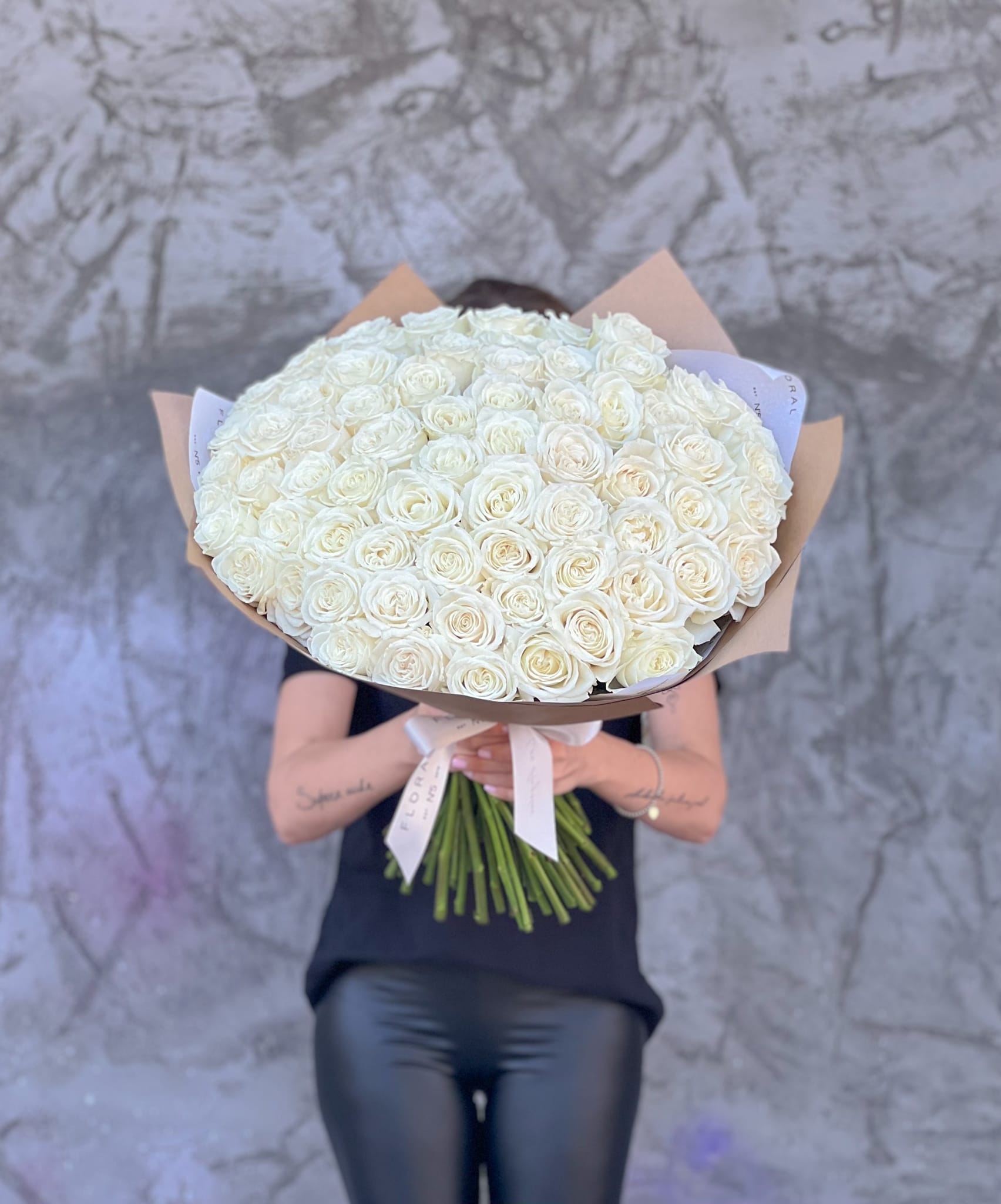 No.136-White Roses - Handcrafted by our expert florist in Studio City, this bouquet features classic roses arranged with timeless elegance and care. Perfect for any occasion, it brings beauty and sentiment together in every petal. Enjoy the convenience of same day flower delivery, making it easy to send love and joy right when it matters most. Discover the charm of a rose bouquet that speaks volumes.  Available in three size options: Standard size - 75 roses Deluxe size - 100 Premium size - 150 roses.  On the photo: Size - Standard.
