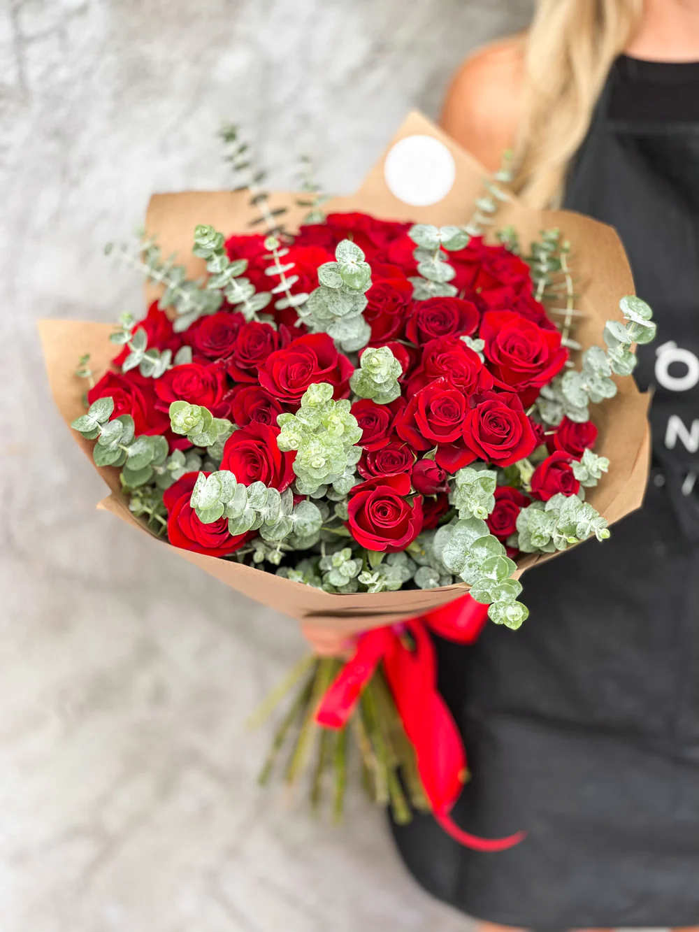 NO.143 - RED DREAMS NO.143 - RED DREAMS - Handcrafted by our expert florist in Studio City, this bouquet features classic roses arranged with timeless elegance and care. Perfect for any occasion, it brings beauty and sentiment together in every petal. Enjoy the convenience of same day flower delivery, making it easy to send love and joy right when it matters most. Discover the charm of a rose bouquet that speaks volumes. Available in three size options: Standard size - 18 stems regular and 6 spray red roses, eucalyptus Deluxe size - 25 stems regular and 10 spray red roses, eucalyptus Premium size - 33 stems regular and 14 spray red roses, eucalyptus On the photo: Size - Standard.