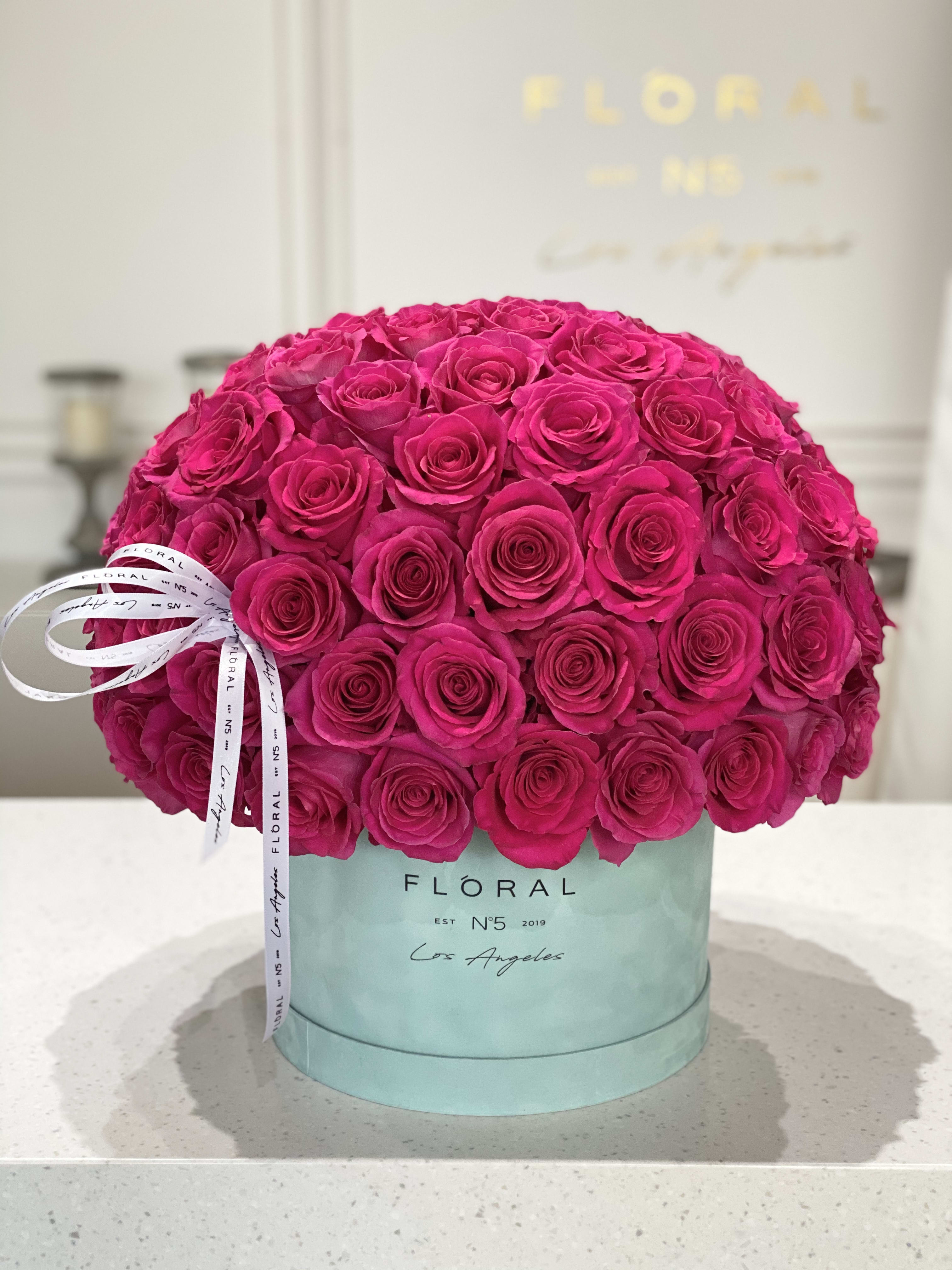 No.144-Pink Floyd Roses No.144-Pink Floyd Roses - Expertly arranged by our skilled florist in Studio City, this box of classic hot pink roses offers a modern twist on a timeless gesture. Elegant and refined, it's the perfect gift for any occasion. With same day flower delivery available, sending a stunning floral surprise has never been easier. Experience the beauty and sophistication of a luxurious rose presentation. Available in diverse box textures and colors. Standard size - 50 roses. Deluxe size - 75 roses. Premium size - 125 roses. On the photo: Size - Deluxe, Box Material - Velvet, Box Color - Grey-Blue.