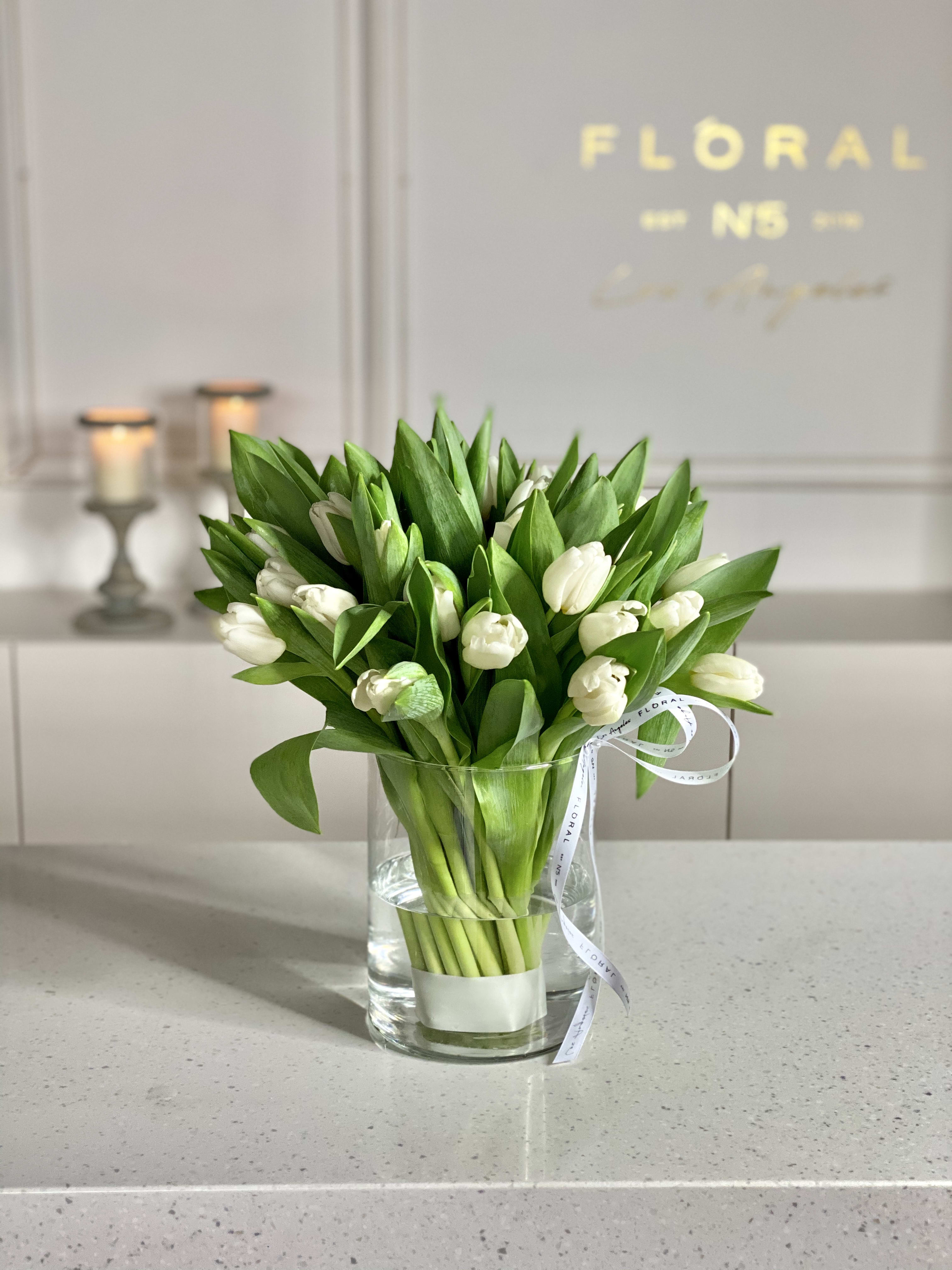 No.16-Tulips in a Glass Vase MD No.16-Tulips in a Glass Vase MD - Handcrafted by our expert florist in Studio City, this bouquet features classic white tulips arranged with timeless elegance and care. Perfect for any occasion, it brings beauty and sentiment together in every petal. Enjoy the convenience of same day flower delivery, making it easy to send love and joy right when it matters most. Discover the charm of a rose bouquet that speaks volumes. 30 stems in glass vase.