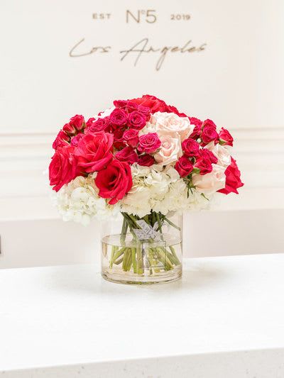 NO.18 - GARDEN ELEGANCE NO.18 - GARDEN ELEGANCE - This mixed flower bouquet in a vase is a heartfelt expression of life’s most meaningful moments—crafted with care by our dedicated florist in Studio City. Each stem is thoughtfully selected to create a vibrant blend of color, fragrance, and feeling. More than just flowers, it's a gesture that speaks volumes. With same day flower delivery, your sentiment arrives right on time, beautifully delivered and impossible to forget. Bouquet with hot pink roses, hydrangeas, and spray roses. Vase 6 x 6
