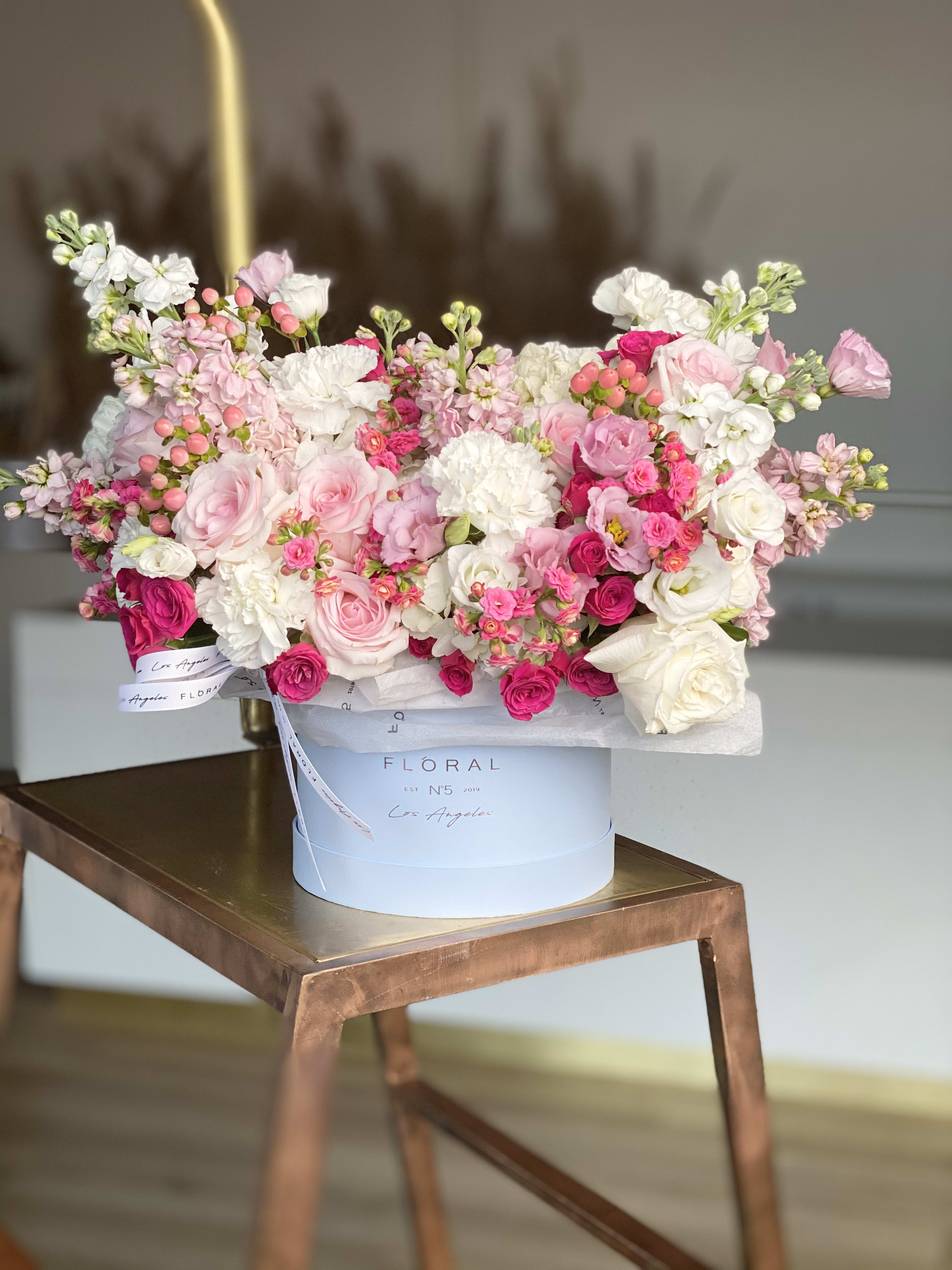 No.219-Roses & Matthiolas No.219-Roses & Matthiolas - A modern take on floral gifting, this mixed flower box is a curated blend of white and pink Roses and matiolas, and textures, thoughtfully designed in Studio City. Each box is a unique expression of beauty and emotion—perfect for making a lasting impression. Whether it’s a celebration or a simple gesture of love, our same day flower delivery ensures your heartfelt gift arrives fresh, elegant, and right on time. Available in three size options and diverse box textures and colors. On the photo: Size - Deluxe, Box Material - Paper, Box Color - Blue.