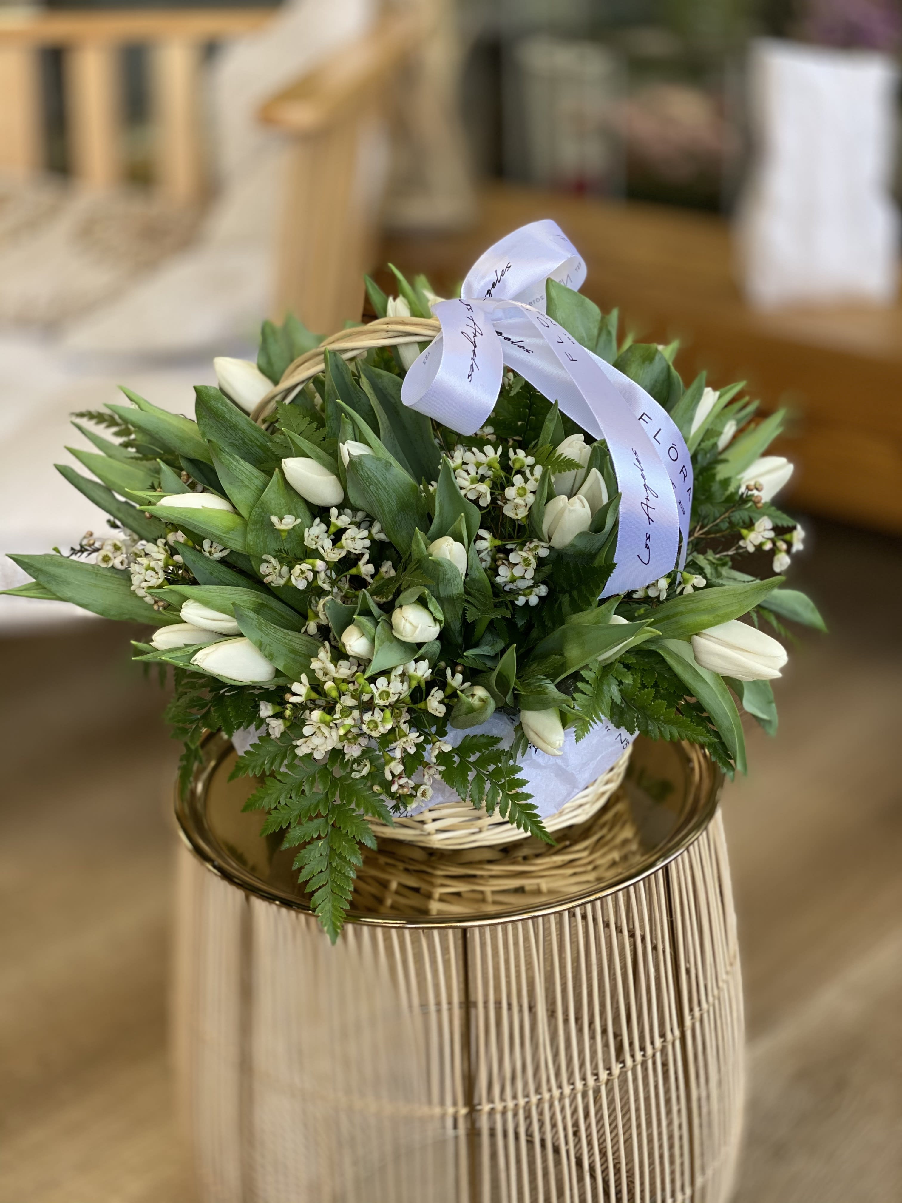No.271 - Tulips & Wax Flowers No.271 - Tulips & Wax Flowers - Expertly arranged by our skilled florist in Studio City, this basket of white tulips offers a modern twist on a timeless gesture. Elegant and refined, it's the perfect gift for any occasion. With same day flower delivery available, sending a stunning floral surprise has never been easier. Experience the beauty and sophistication of a luxurious rose presentation. Gorgeous basket with 50 white tulips, wax flowers and greenery. Size on the picture - standard.