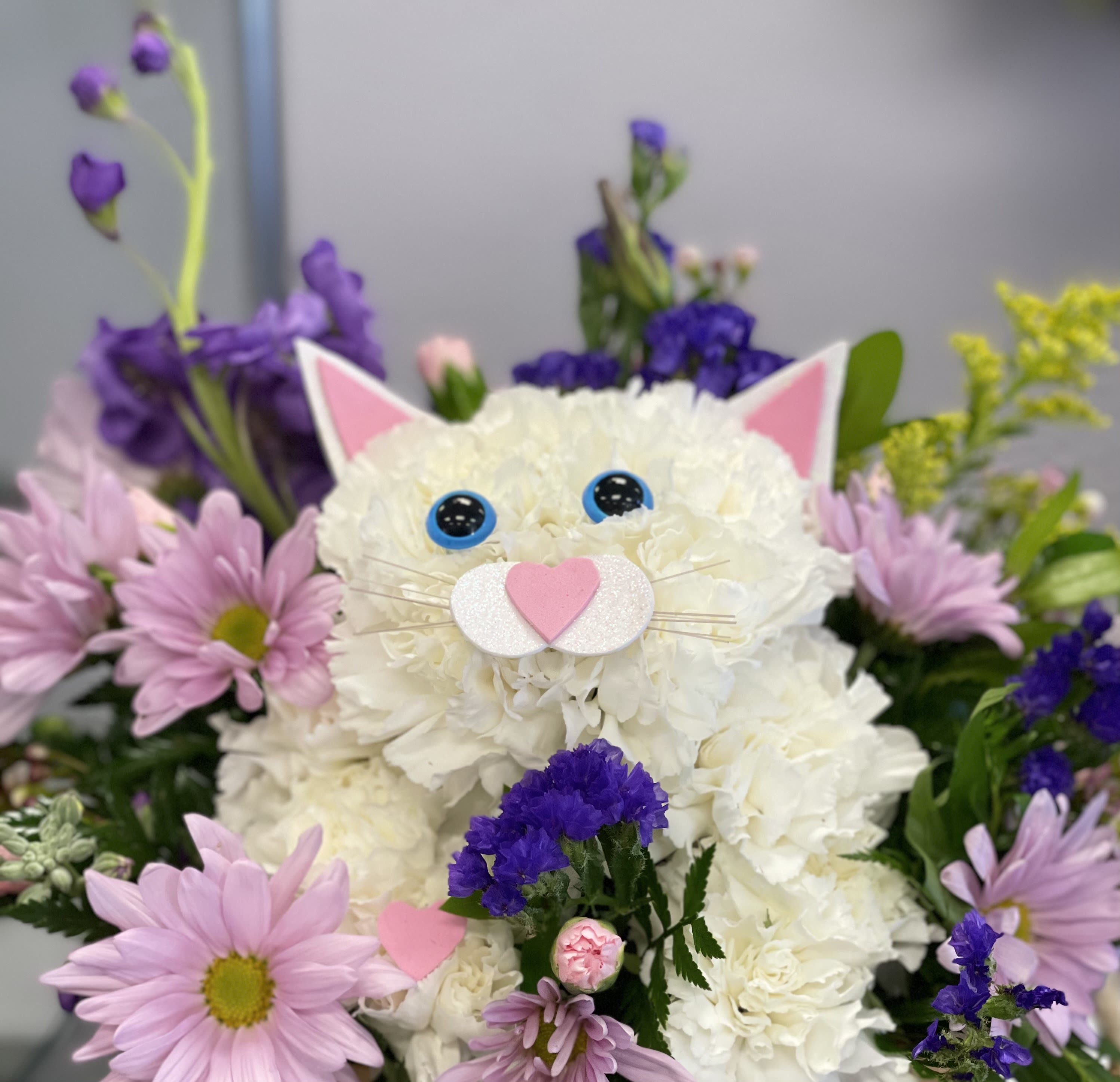 Snowball The Cat Snowball The Cat - Our playful cat is a fun way to send flowers to a loved one or friend. Purrfect for any occasion. **Flowers, accents and colors may vary based on availability** Only available for local delivery**