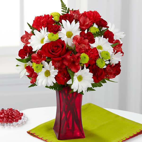 Cherry Sweet Bouquet Cherry Sweet Bouquet - The FTD® Cherry Sweet™ Bouquet comes straight from our fun trendy and simply irresistible Color Confection Collection. Racing with red this stunning flower bouquet begins with red roses Peruvian Lilies and carnations offset by burgundy mini carnations white traditional daisies green button poms and lush greens to create an arrangement that finishes with cherry popping beauty . Presented in a red glass vase to give it a perfectly candy coated look this mixed flower arrangement is set to send your sweetest wishes to friends and family in honor of a birthday as a thank you or just to celebrate in style.