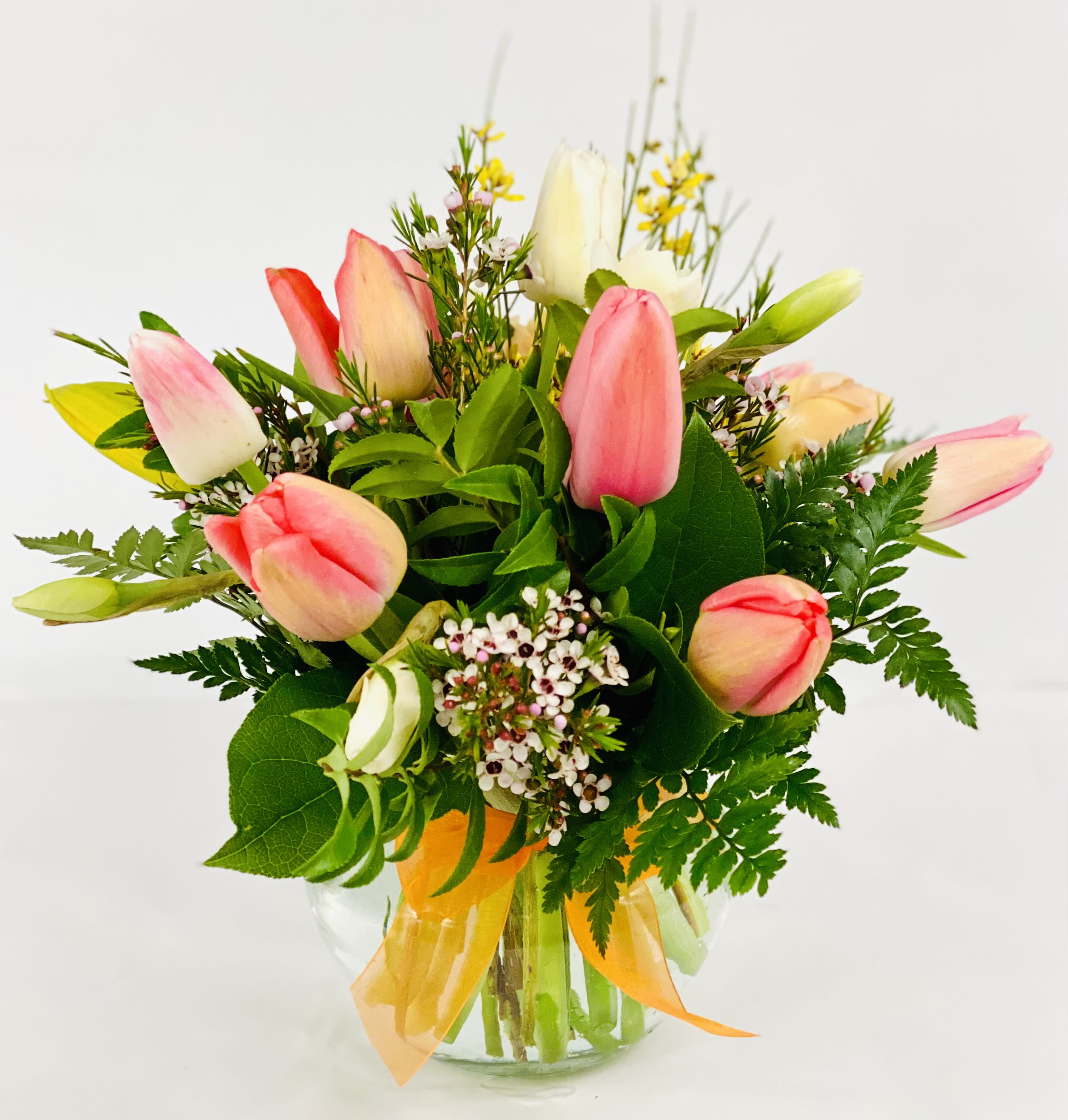 Tulip Bouquet by Barb’s Flowers - This arrangement of Tulips will brighten anyone’s day.  It will be a mixture of Dutch, Fringe and or Parrot Tulips and colors with seasonal fillers and greenery. 