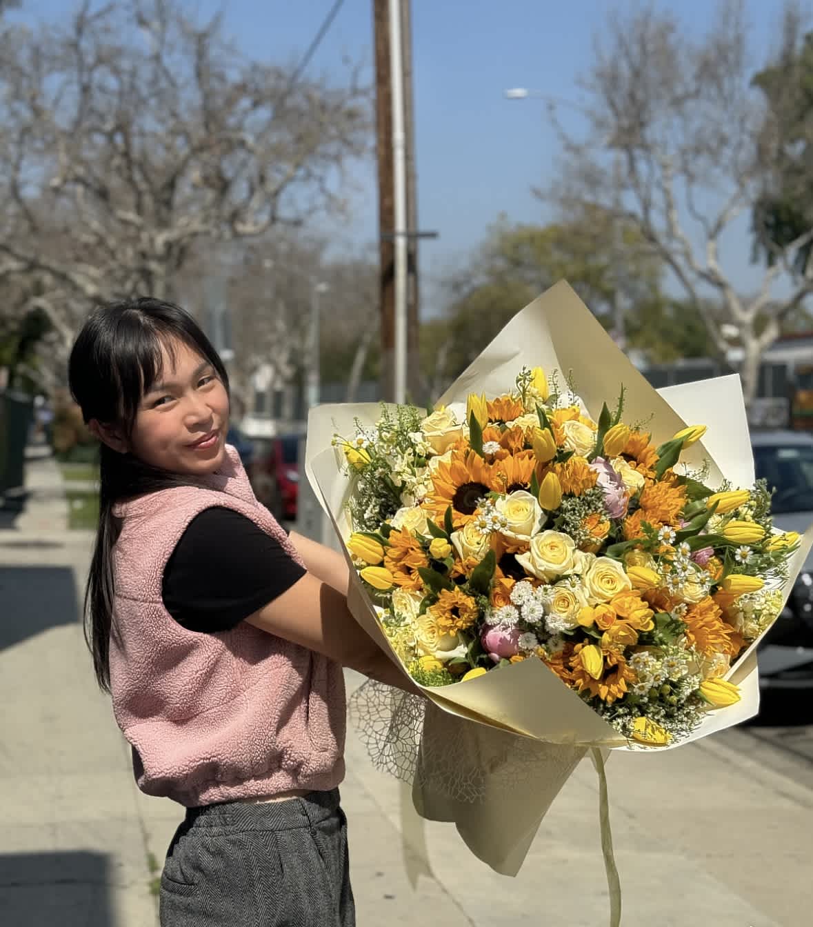 Sunny Day Bouquet - A mega bouquet of yellow flowers including roses, sunflowers, tulips, and other flowers.  We offer different colors and styles for wrapping paper. Please note in Florist Instructions your choice of wrapping paper. We have one solid color like red, pink, white, classic brown, clear, etc. We also have two side colors like white/gold, light pink/hot pink, pink/purple, blue/white etc. And lastly, we have them in shiny/iridescent colors, or texture/style paper. Call us at 323-961-6686 if you have any questions.
