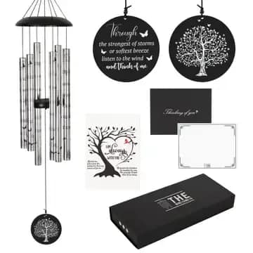 Memorial Boxed Windchime - Introducing the 40&quot; Memorial Wind Chime – a heartfelt tribute designed to bring solace and comfort to those who are grieving the loss of a loved one. Crafted with unwavering attention to detail, this exquisite wind chime captures the essence of cherished memories through its soothing melodies and elegant design.  Measuring 7.5 inches wide and standing tall at 40 inches, the Amazing Grace Memorial Wind Chime is a stunning piece that stands as a testament to the enduring bond between you and your departed loved one. Its meticulously tuned tubes resonate with timeless notes, scriptures printed on tubes of the beloved hymn &quot;Amazing Grace,&quot; a musical tribute that echoes the sentiments of love, hope, and healing. 