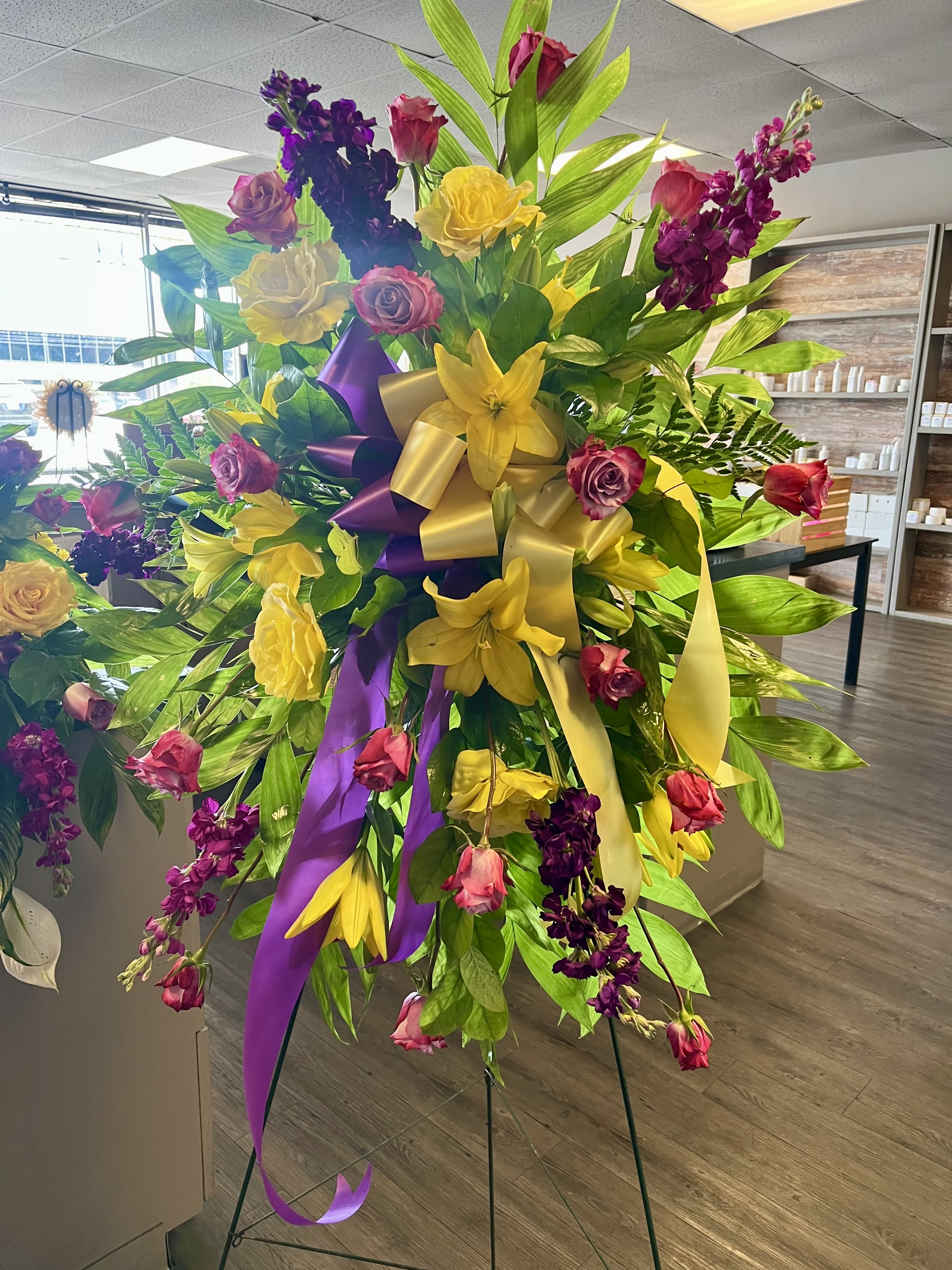 Thoughtful Prayers Standing Spray Thoughtful Prayers Standing Spray - Our Thoughtful Prayers Standing Spray beautifully remembers their passion and radiance within each bright bloom. Bold lilies, roses, stock and snapdragons are paired with lush greens to celebrate the life of a loved one. This grand standing spray is hand delivered and is best suited to send to a service or funeral home. Stands on a 60" easel.