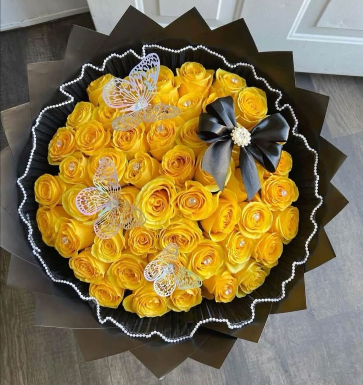 Mis Flores Amarillas Mis Flores Amarillas - 50 Yellow Roses arranged in Buchón style Bouquet.