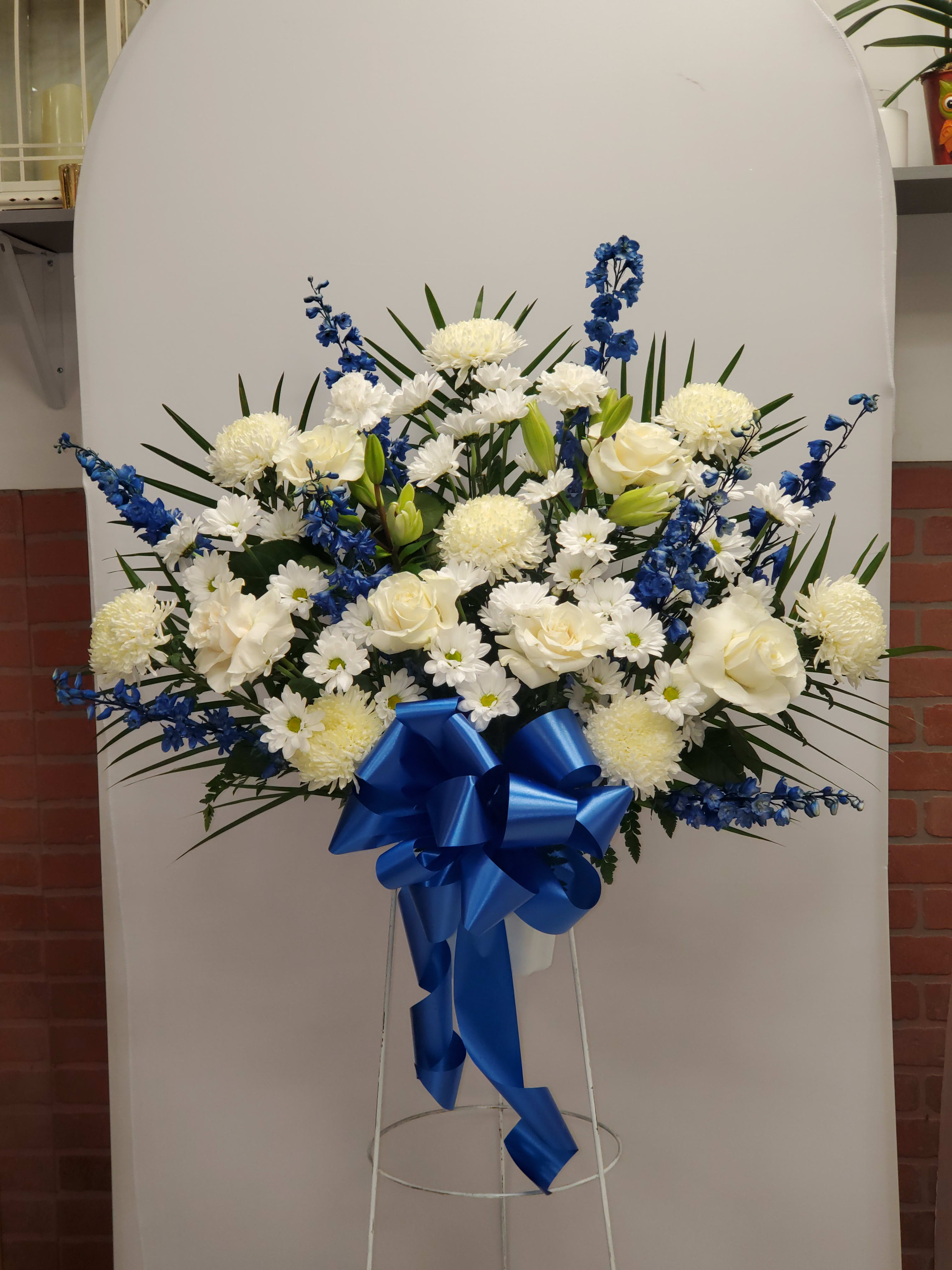 Blue and White standing basket  - This Blue and White standing basket includes, 8 white mums, 8 blue delphinium, 8 white daisy, 2 white carnations and 8 white lilys.