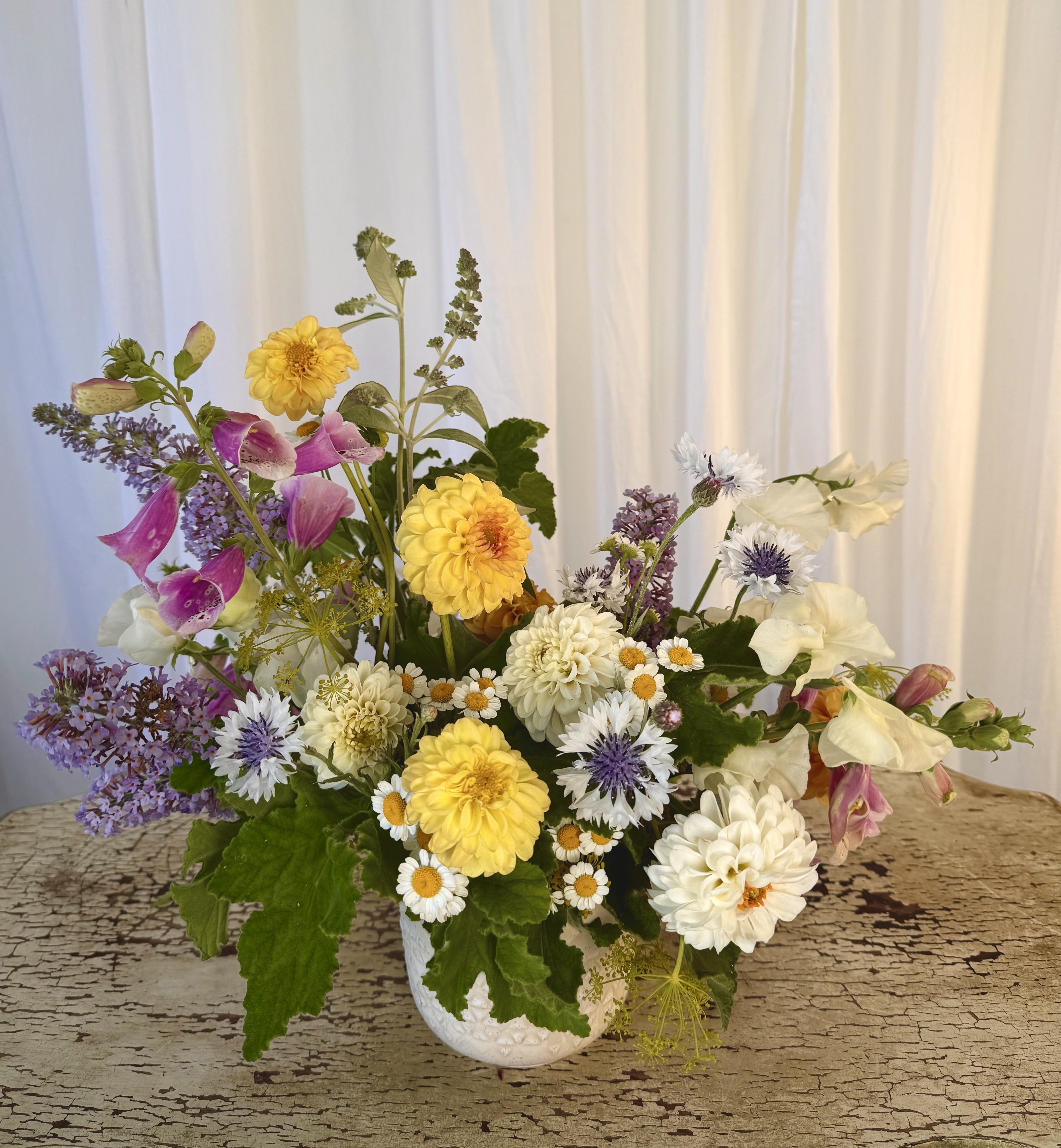 &quot;Artist's Choice&quot; SMALL - Our absolute most eclectic selection. We use the most unique, wild, and sculptural pieces that week and create a work of art! Your arrangement will not be the same as the one pictured, instead it will be different colors, different flowers, completely seasonal and fresh, and also uniquely yours! If you trust us, let us run free!  Concerning Seasonality: As a seasonal, locally-focused florist, we have different product to work with each week. Our focus is on creating a unique piece for each customer, with blooms that are fresh from local farms and growers. While the flower varieties and colors may vary, the quality and freshness will always be the best. It is an honor to have our customers' trust and confidence in our abilities and artistic eye.   Delivery Policy (**PLEASE READ**): Pick-ups at the studio are available after 2pm. Our daily delivery time frame is typically between 12- 3pm. Please specify if you require a certain delivery time and we will do our best to accommodate it, or we will call you if we cannot.   We gently ask that those ordering flowers for someone else to please check first if the recipient of the flowers will be home during that time. Additionally, please be sure to include whether or not there is a gate we may need a code for. If there is no answer at the door, our delivery person will leave the flowers by the doorstep in a weather safe location. Completing your order acknowledges that you have read and understand our delivery policies. 