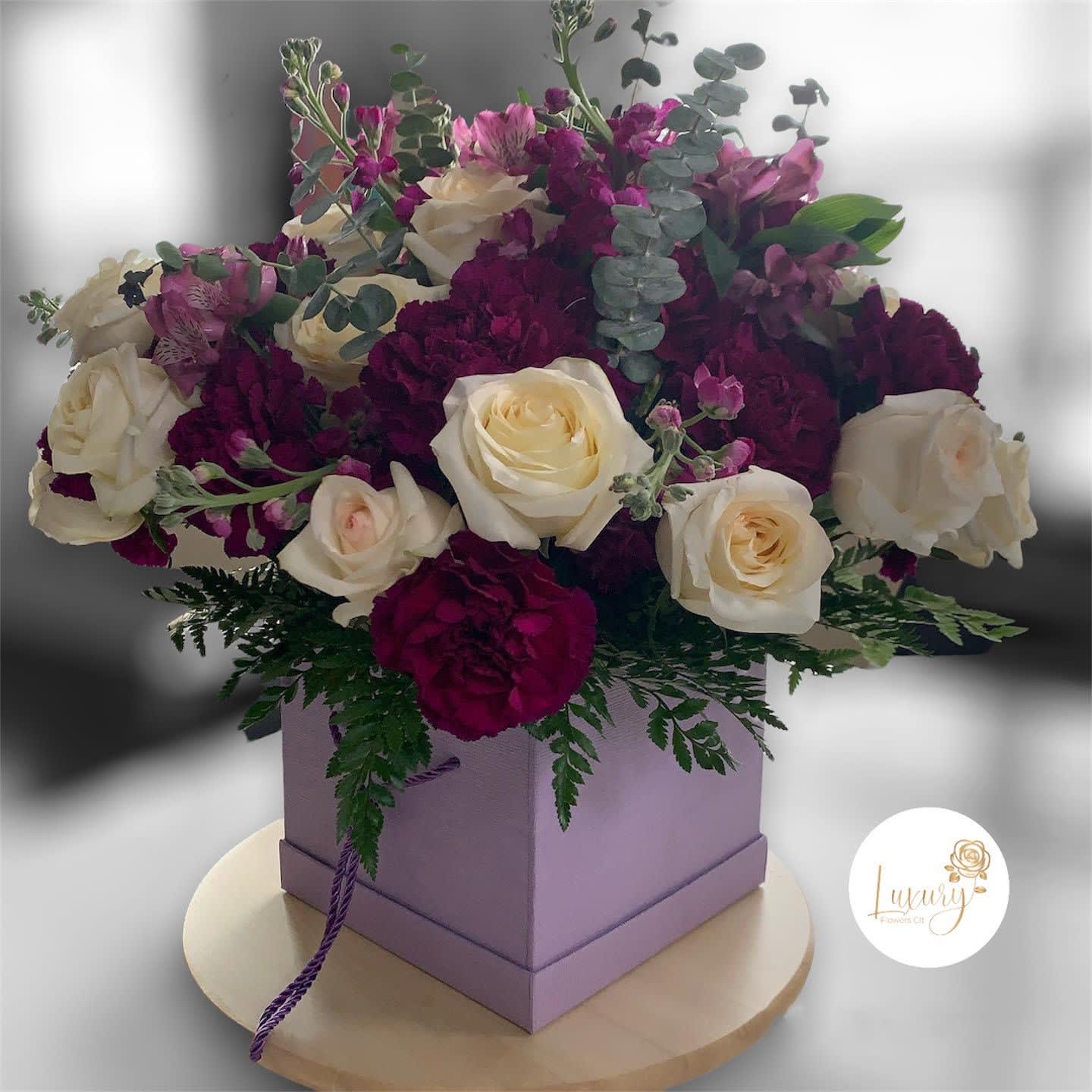 Gia Box - Our exclusive designs of fresh flowers in the beautiful box are a true symbol of luxury arrangements for all occasions. All Occasion Color Box: White or Black (subject to inventory availability) Place your Order Online Monday to Saturday before 1:00 p.m. (E.T.) for same-day delivery.  “Orders received after hours will be delivered the next business day”. Check our coverage area. Occasionally, substitutions of flowers and/or containers happen due to weather, seasonality, and market conditions which may affect availability. If this is the case with the gift you’ve selected, we will ensure that the style, theme, and color scheme of your arrangement are preserved and will only substitute items of equal value or higher value.  CARE INSTRUCTIONS Gently mist the arrangement with natural water every other day. Do not spray any cleaning product on the flower arrangement. Do not place heavy objects directly on the flower arrangement. Keep them out of direct sunlight and extreme heat.  