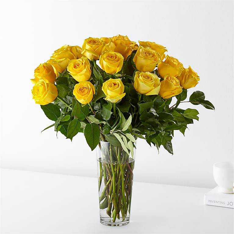 Classic 24 Long Stem Yellow Roses  - 24 Yellow Roses Deluxe All Occasion Clear Glass Place your Order Online Monday to Saturday before 1:00 p.m. (E.T.) for same-day delivery.  “Orders received after hours will be delivered the next business day”. Check our coverage area. Occasionally, substitutions of flowers and/or containers happen due to weather, seasonality, and market conditions which may affect availability. If this is the case with the gift you’ve selected, we will ensure that the style, theme, and color scheme of your arrangement are preserved and will only substitute items of equal value or higher value.
