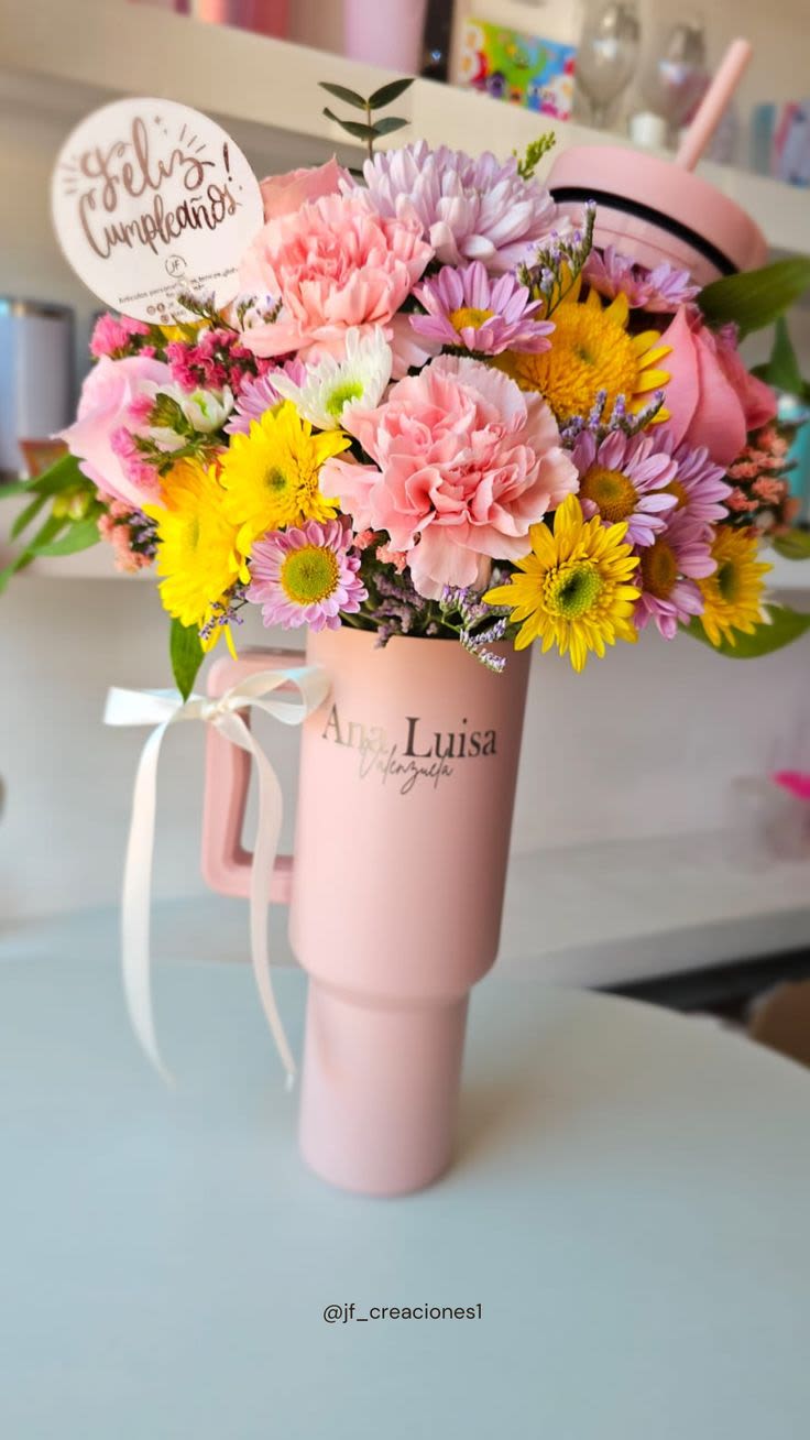 Delicate but Sweet - Stanley Mug Arrangement More than just flowers — it's a thoughtful gift. Each Stanley-style mug is reusable, making it a lasting keepsake, while the carefully selected blooms speak volumes of love and appreciation. Perfect for showing affection, saying thank you, or simply making someone smile.  Delivery available — Give beauty with purpose, only at Yansa Flowers 