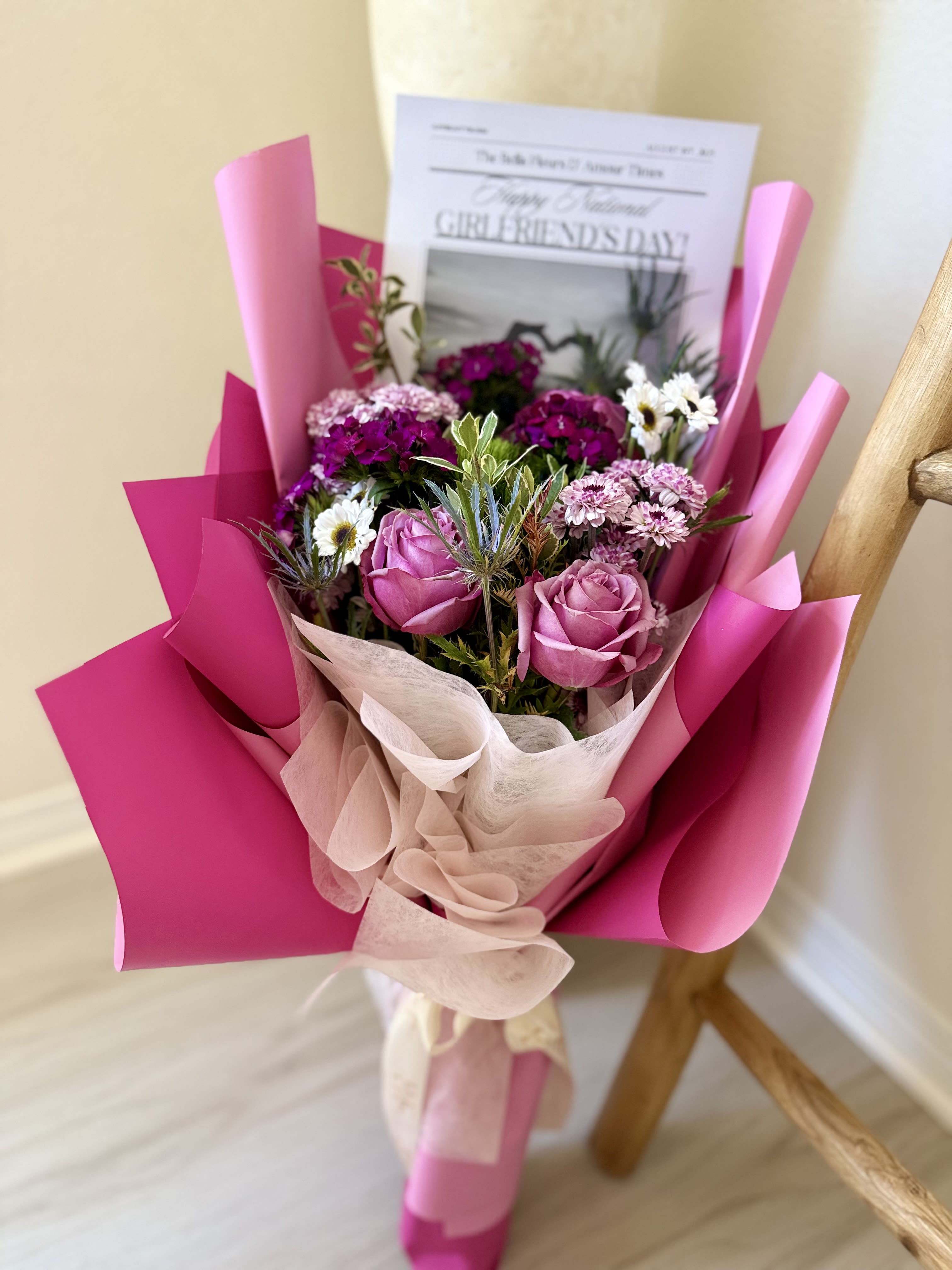 National Girlfriends Day mixed floral bouquet - Designers choice mixed florals elegantly arranged in a bouquet with out national girlfriends day newsletter!