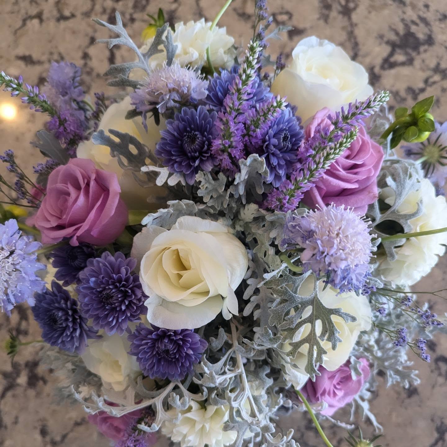 Blue Wave - Blue, white and purple flowers such as Mums, Roses and Veronicas. (flowers will be based on the season) *This is an example only and may be a little different for your order*