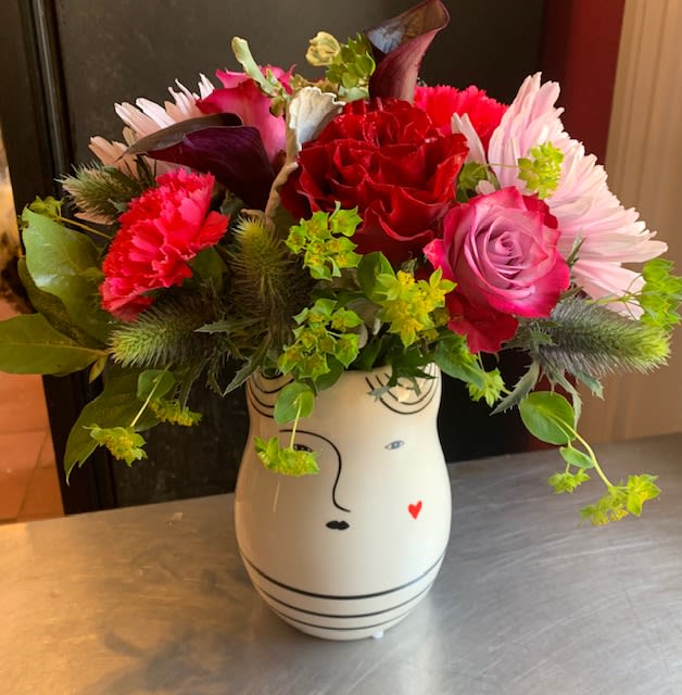 Not Just Another Pretty Face Not Just Another Pretty Face - My this lady has a pretty face (and the flowers aren't too bad either). Featuring, roses, calla lily, and football mums.