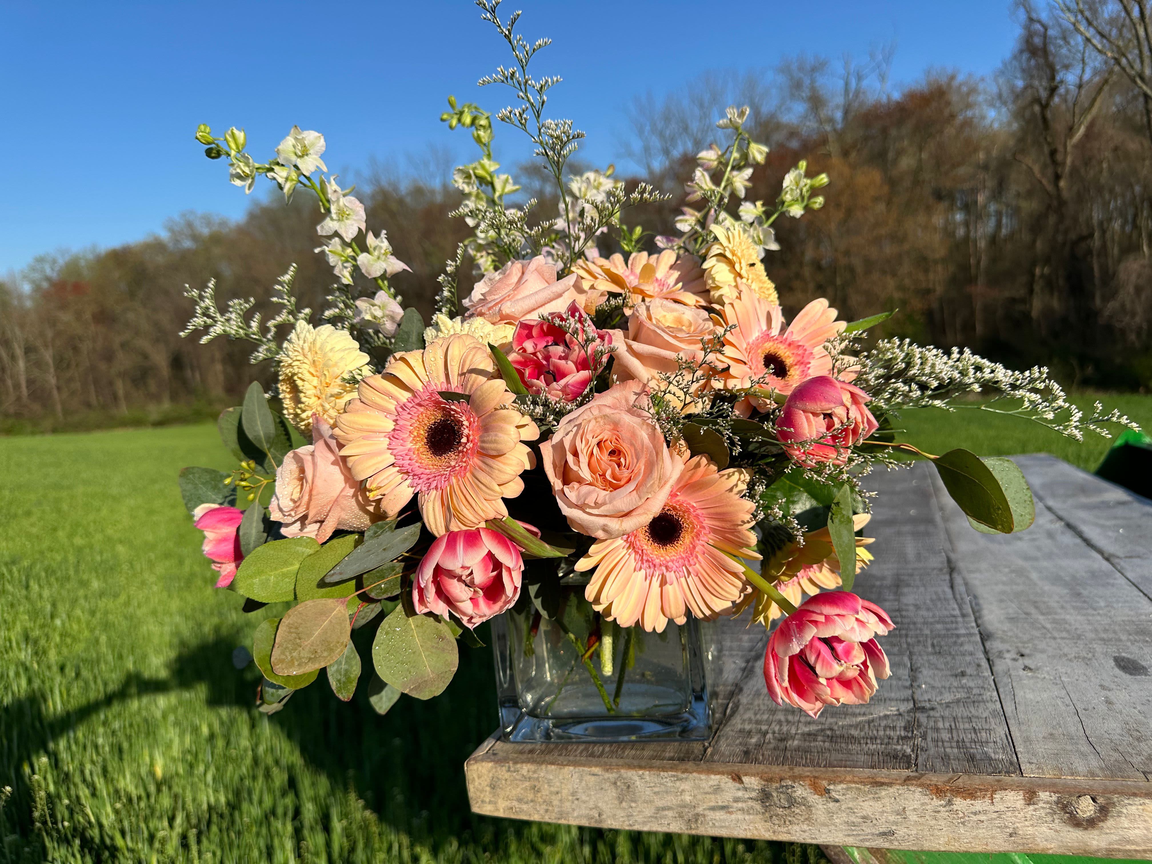 Pastel Designer’s Choice Arrangement - Let The Flower Cart, your trusted Baltimore florist, surprise you with a one-of-a-kind Pastel Designer’s Choice Arrangement. Expertly curated with the freshest seasonal blooms, this arrangement highlights soft, romantic hues and locally grown farm flowers for a naturally elegant look. Hand-selected by our talented floral designers, each arrangement is unique—featuring pastel tones and delicate greens that reflect the beauty of Maryland’s local flower farms. No two arrangements are the same, but every arrangement is guaranteed to be fresh, stunning, and full of charm. Enjoy the convenience of same-day flower delivery in Baltimore, and let us bring the joy of farm-fresh flowers right to your home, office, or someone special’s doorstep.  Accent flowers and color combinations may vary based on seasonal availability.