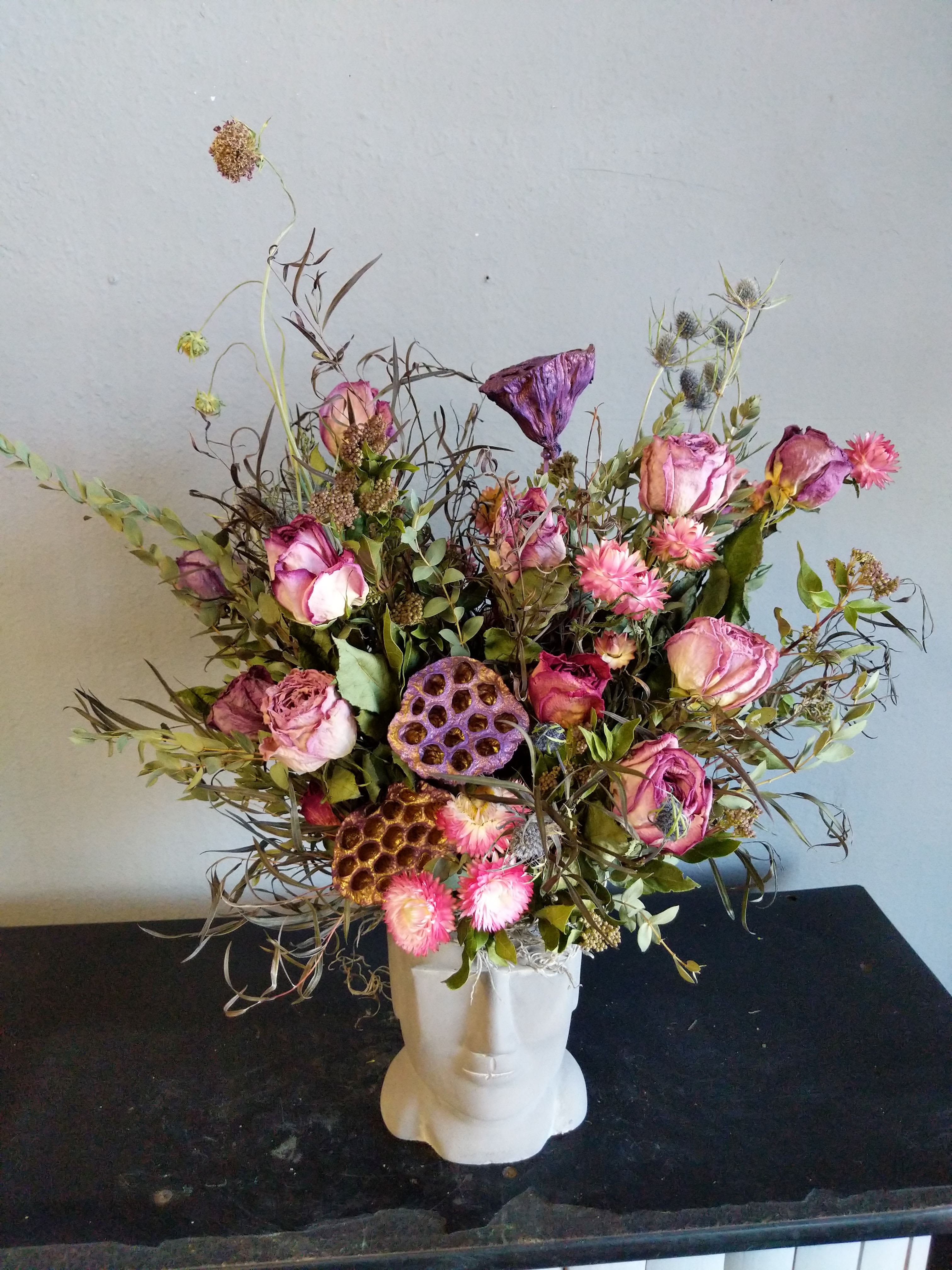 # 134 Summer Dried Floral Arrangement - A beautiful Died flower arrangement that is sure to WOW! This Whildflower Dired arrangement is full of texture, pods and designed in a unique cement head. No water needed, why you ask..... Because they are DRIED flowers! Long lasting and fun! 