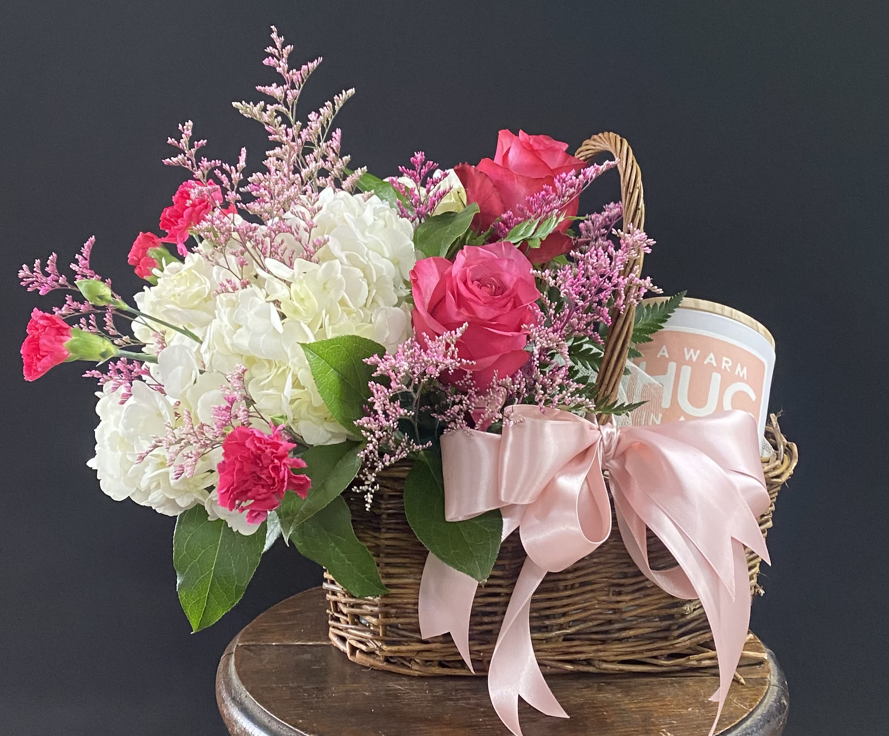 Warm Hug Candle Basket - This basket of lush florals and a candle is a great gift for anyone.  Who doesn't need a basket full of flowers and a candle : ) The candle says &quot;Warm Hug in a Jar&quot; and the scent is Vanilla Delight.   Flowers can always be customized, just let us know in &quot;Special Instructions&quot; or give us a call.