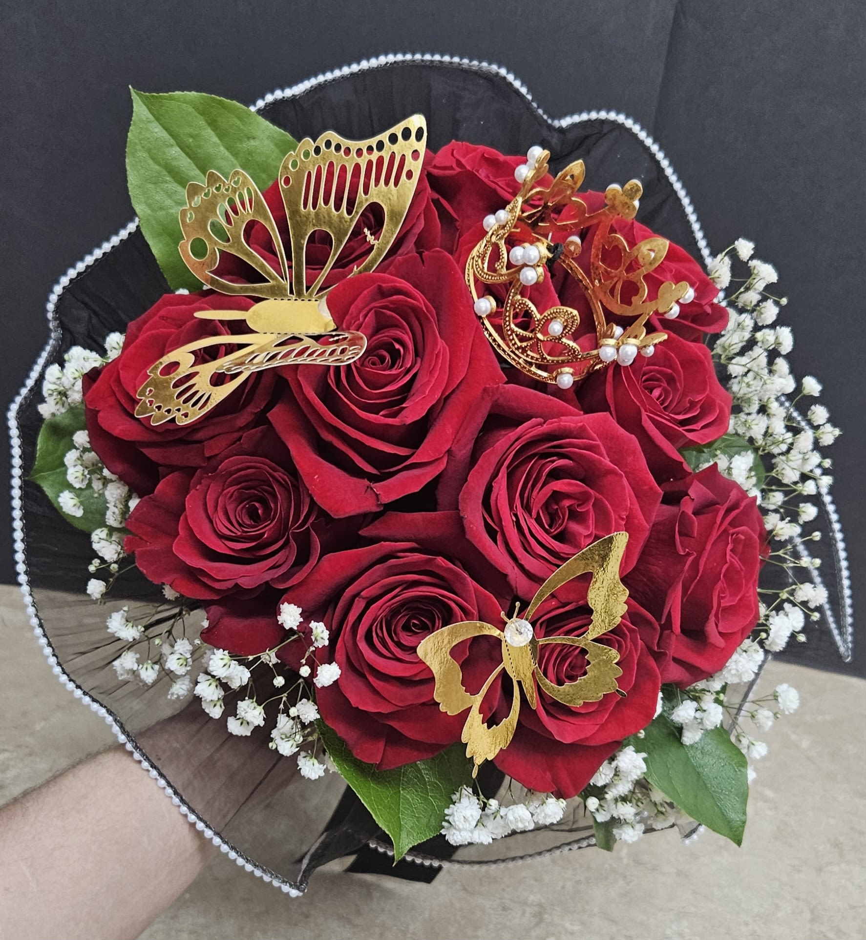 My Queen Bouquet Wrapped - Beautiful 12 red roses with baby's breath wrapped in black lace with butterflies and a crown. Vase not included