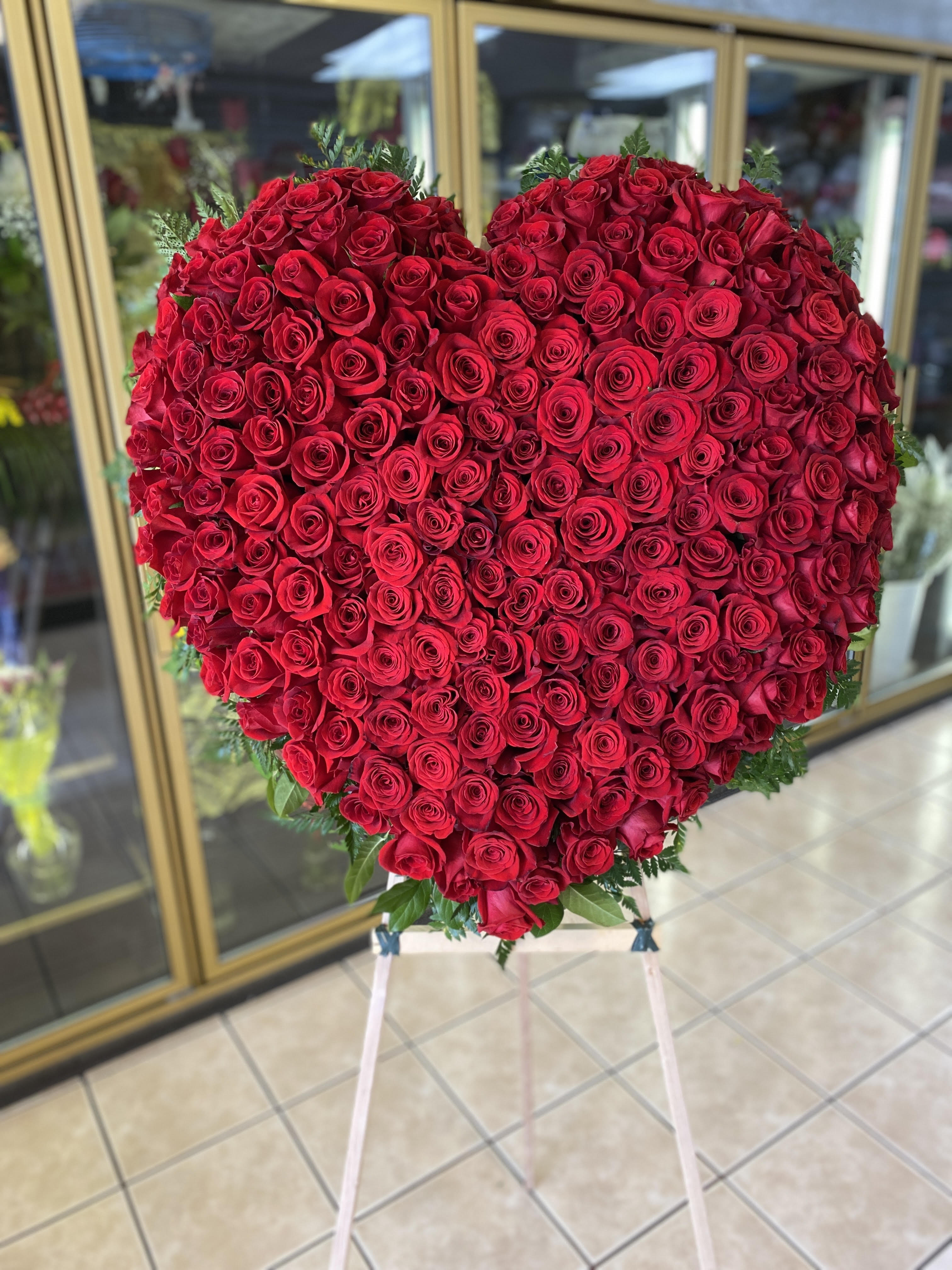 Rose Heart Rose Heart - Large and tall arrangement includes - Red Rose heart spray stand, Approximate dimensions 60" x 48"