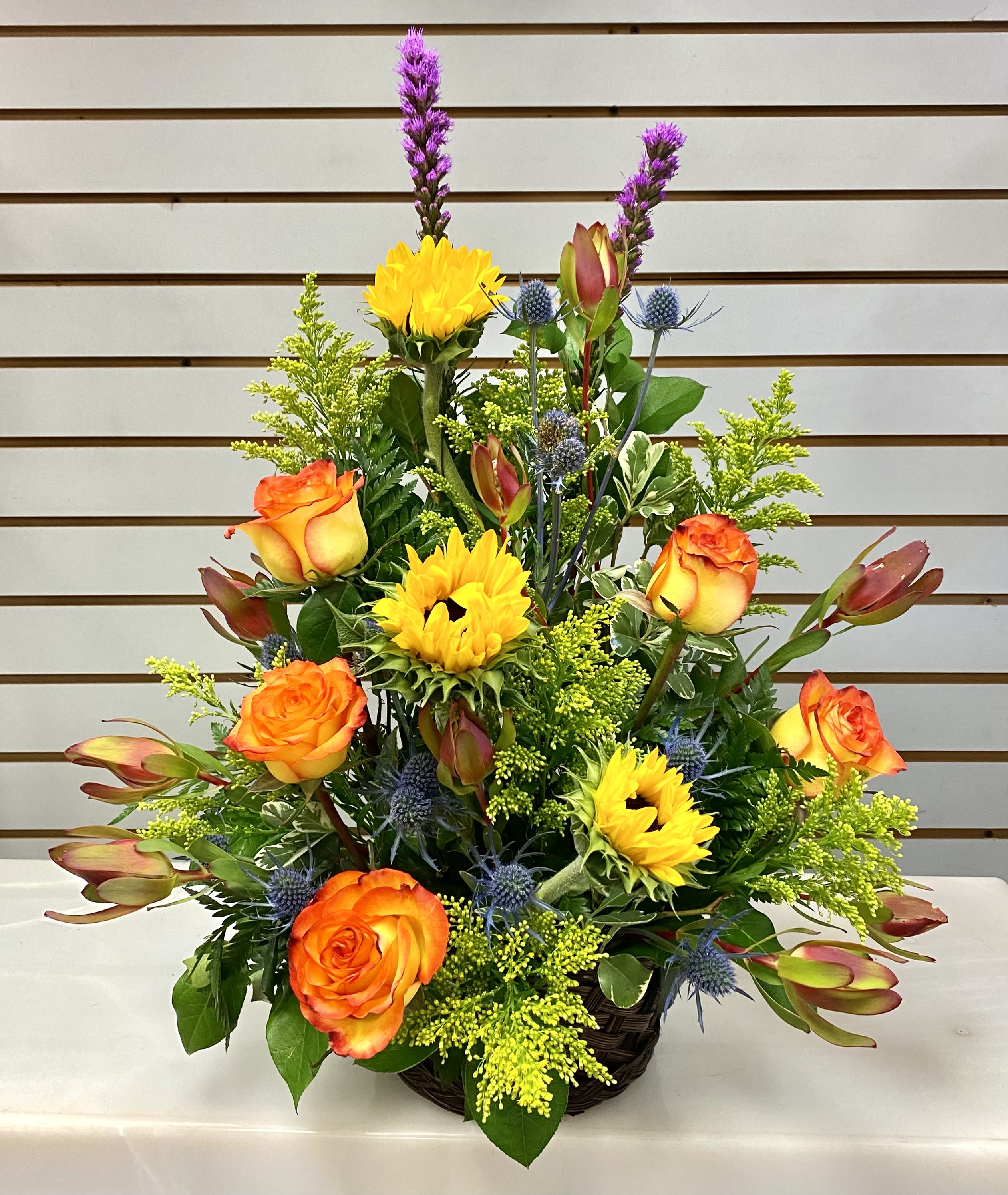 Brighter Days Brighter Days - Roses, sunflowers mixed greenery and flowers.