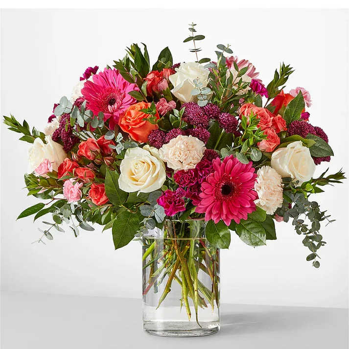 Smell the Roses Bouquet (exquisite) Smell the Roses Bouquet (exquisite) - Whether you are celebrating a milestone or simply wishing well, these hot pink and striking orange florals will be a reminder of nature's beauty. Details The Deluxe Bouquet is approximately 12"H x 15"W. Designed by florists, ready to display. For long–lasting blooms, replace the water daily. We suggest trimming the stems every couple days. Pet Safety Precautions: This bouquet or plant may include flowers and foliage that are known to be toxic to pets. To keep them safe, be sure to keep this arrangement out of your pet's reach.