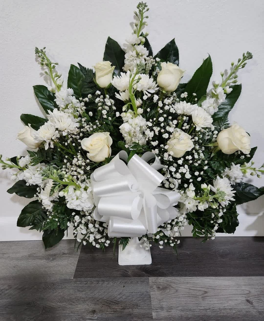 Beautiful Soul - Send your deepest condolences to the family and friends with a basket of flowers that embraces the beauty of a loved one.