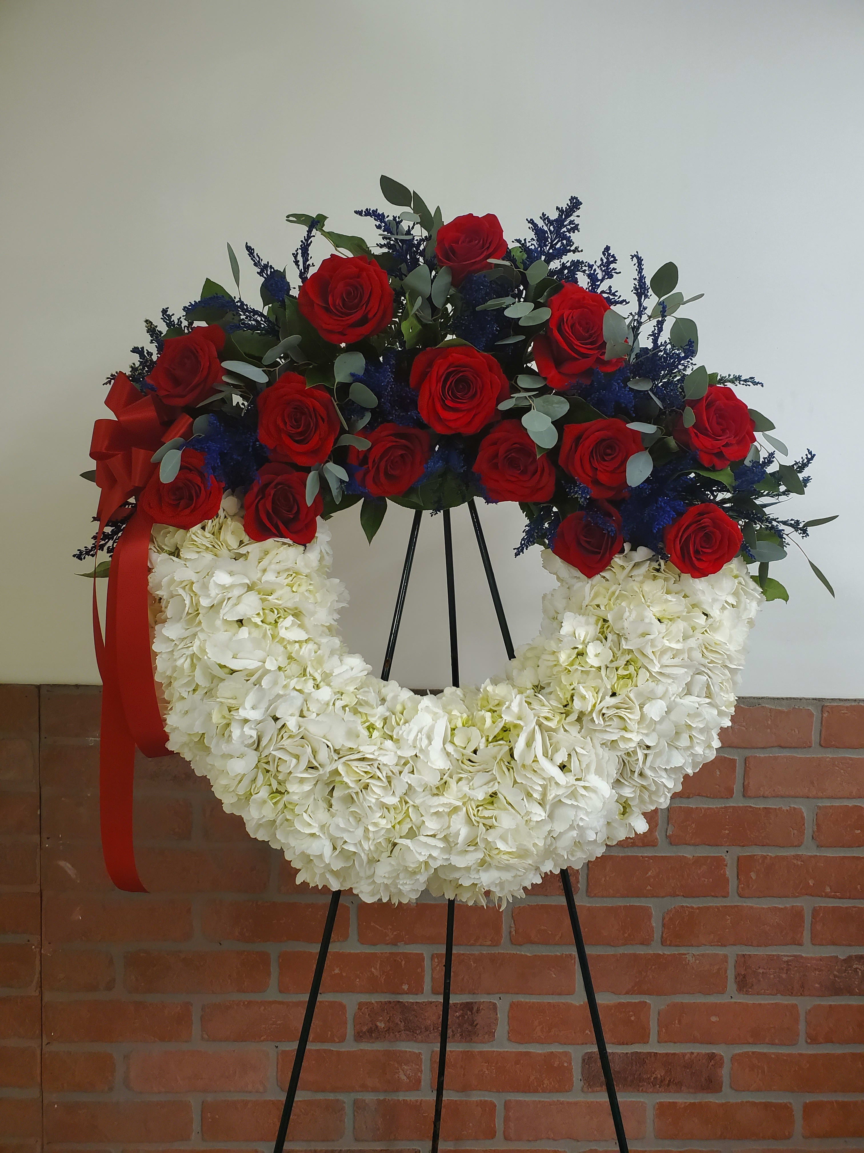 American Soul by Manny - A perfect way to honor their beliefs and actions, this red, white, and blue wreath is a tribute to those who loved their country. 