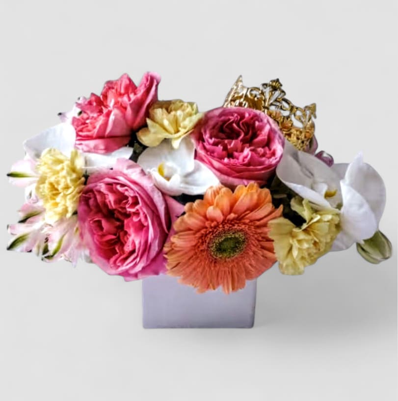 My Queen Bouquet My Queen Bouquet - Roses orchids and more arranged in a white glass modern cube style vase adorned with a gorgeous gold crown. Perfect to send today to show them how much you care. Always made unique and extra special each and every time. Send them happiness.