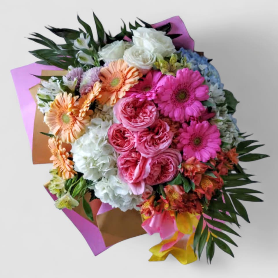 Bouquet Bellissimo Grande Bouquet - Designer's choice; made beautifully from my blossom selection of the day. Send this beauty today to show them how much you care with it's massive amount of colorful blossoms of that day roses orchids and so much more arranged as a wrapped style bouquet to present to them wrapped in paper with long flowing ribbons. Gorgeous! Please visit my beautiful gallery to see my most recent designs that I have created for my online customers. Send them happiness today.