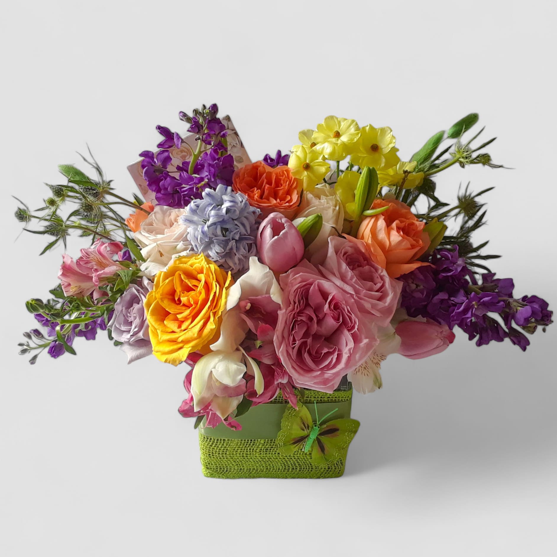 Bella Happy Birthday Beautiful Bouquet Designer's Choice - Roses orchids and more. Perfect for every occasion. Send this beautiful bouquet today to show them how much you care with it's beautiful mixed blossoms of that day arranged in a modern glass cube vase wrapped in beautiful citrus jute ribbon. All flower arrangements that leave my flower studio are beautiful works of art, made special and unique each time. Please visit my beautiful gallery to see my most recent designs that I have created for my online customers. Send them a special bouquet to make them smile today.