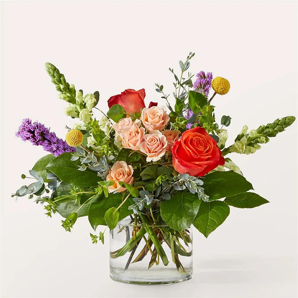 The Standout Bouquet  - Leave a lasting impression with The Standout Bouquet, a vibrant and bold mix of orange and purple florals. Details The Standard Bouquet is approximately 11&quot;H x 12&quot;W. Designed by florists, ready to display. For long–lasting blooms, replace the water daily. We suggest trimming the stems every couple days. Pet Safety Precautions: This bouquet or plant may include flowers and foliage that are known to be toxic to pets. To keep them safe, be sure to keep this arrangement out of your pet's reach.