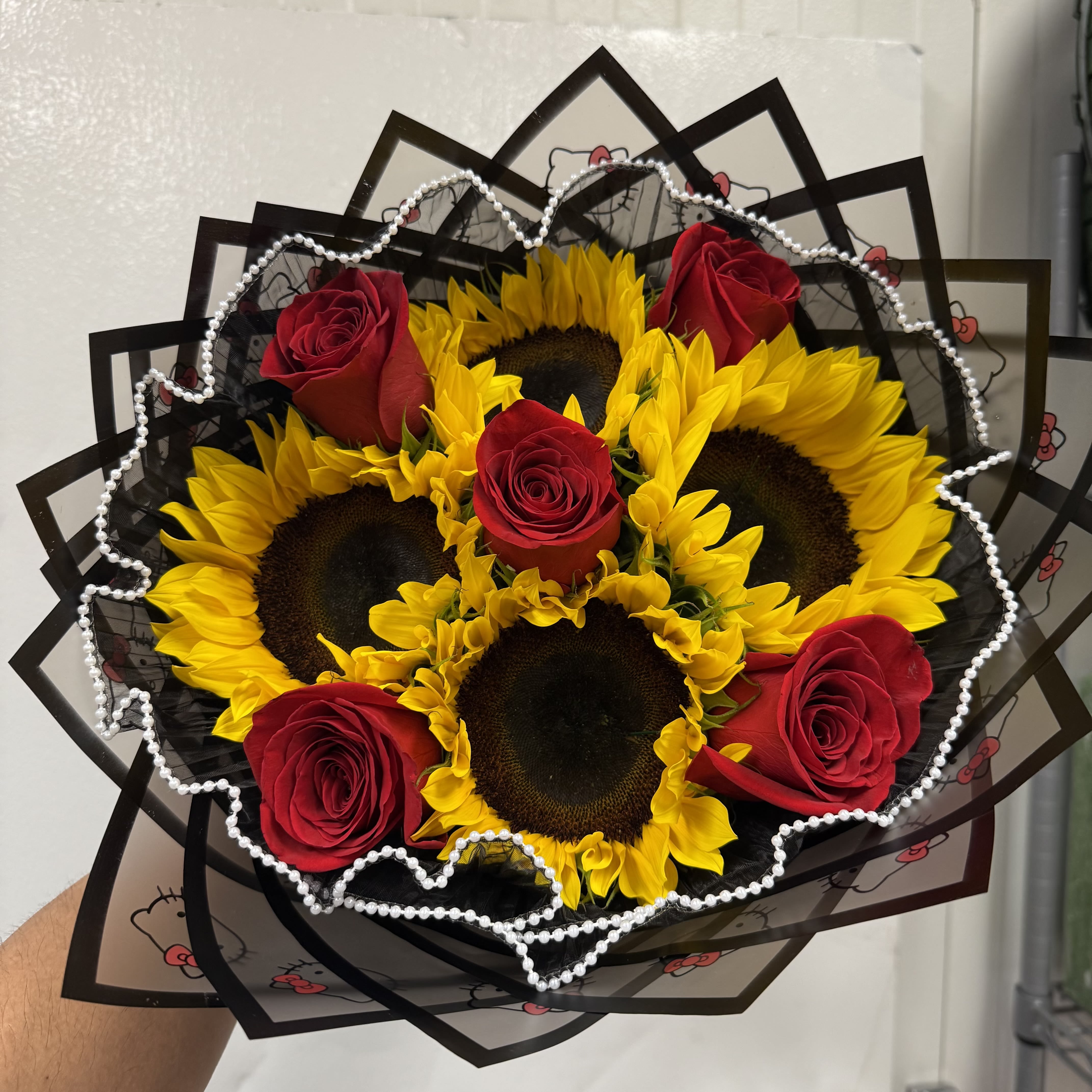Sunflower Rose Mix - 4 Sunflowers with 5 red roses wrapped in paper 