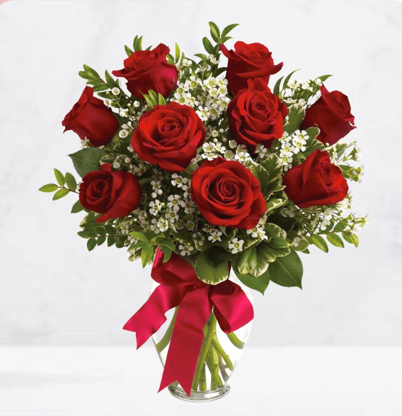 8 roses in a vase  - 8 roses plus fillers and greenery