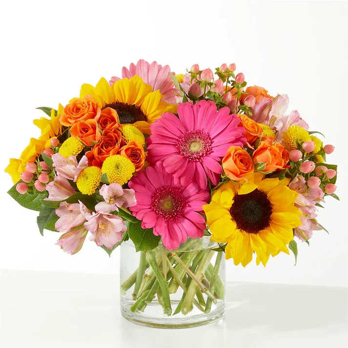 Beach Day Bouquet  - As colorful as a wagon full of beach toys, this energetic arrangement captures the best moments of a sun-soaked day by the water. Details The Standard Bouquet is approximately 10&quot;H x 12&quot;W. Designed by florists, ready to display. For long–lasting blooms, replace the water daily. We suggest trimming the stems every couple days. Pet Safety Precautions: This bouquet or plant may include flowers and foliage that are known to be toxic to pets. To keep them safe, be sure to keep this arrangement out of your pet's reach.