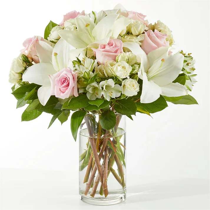 Kindhearted Bouquet (exquisite) Kindhearted Bouquet (exquisite) - The Kindhearted Bouquet is a gentle swirl of pale pink and ivory blooms, the perfect way to share a sweet sentiment with those you hold near and dear. Details The Deluxe Bouquet is approximately 14"H x 14"W. Designed by florists, ready to display. For long–lasting blooms, replace the water daily. We suggest trimming the stems every couple days. Pet Safety Precautions: This bouquet or plant may include flowers and foliage that are known to be toxic to pets. To keep them safe, be sure to keep this arrangement out of your pet's reach.