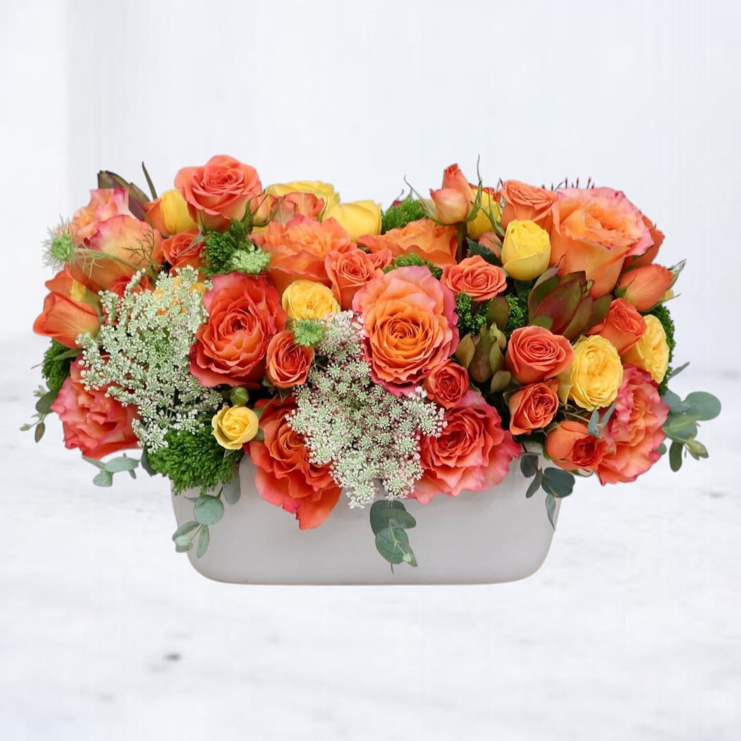 Citrus Anthem Citrus Anthem - Citrus Anthem is a bold, joyful floral arrangement bursting with color and personality. Featuring vibrant orange Free Spirit roses, golden yellow spray roses, and airy Queen Anne’s lace surrounded by lush greenery, this design radiates warmth and positivity. Whether you're saying congratulations, sending get well wishes, or simply making someone’s day brighter, Citrus Anthem brings the celebration to life. Expertly handcrafted and available for same-day flower delivery in Houston, Spring, The Woodlands, Conroe, Magnolia, and Montgomery, this uplifting bouquet is a go-to choice for everyday moments that deserve a splash of color and joy. With Citrus Anthem, it’s always the right time to celebrate.