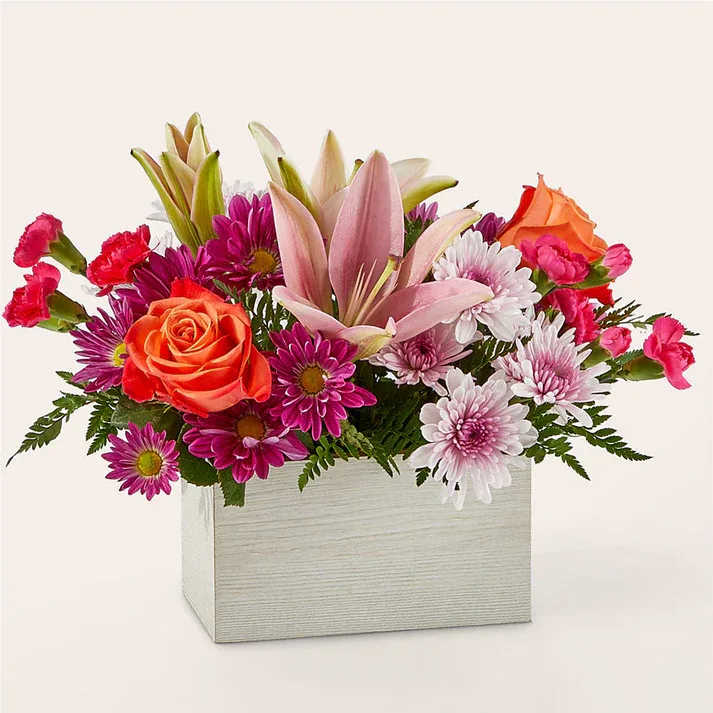 Light of My Life Box Bouquet  - From life's big moments to sweet just because sentiments, the Light of My Life Box Bouquet is designed to celebrate your loved ones any day of the year. RSVP'd to the party are hot pink carnations, orange roses, lavender cushion poms and lush greens.