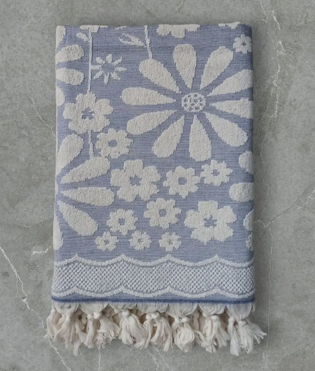 Blue Daisy Turkish Terry Towels - 100% Turkish Premium Cotton with Terry details.  Fast drying- thanks to the unique weave technique and 100% natural premium cotton it dries super fast.  Super portable- great for travel and beaches, it fits easily into a small luggage and beach bag.  Machine washable - Cold Wash and tumble dry at low temperature is recommended.