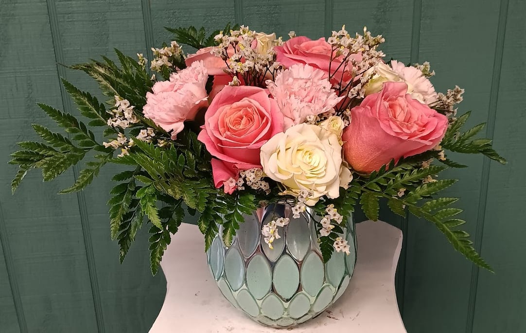 Tickle Me Pink - Delightfully charming and sweet, our Tickle Me Pink arrangement is bursting with soft elegance and cheerful color. Featuring lush pink roses paired with delicate white spray roses, playful pink carnations, and airy limonium, this design is the perfect blend of romance and joy.  Whether you're celebrating a birthday, sending a thoughtful &quot;just because,&quot; or brightening someone’s day, Tickle Me Pink is a heartfelt way to share smiles and love in the prettiest shades of pink and white.
