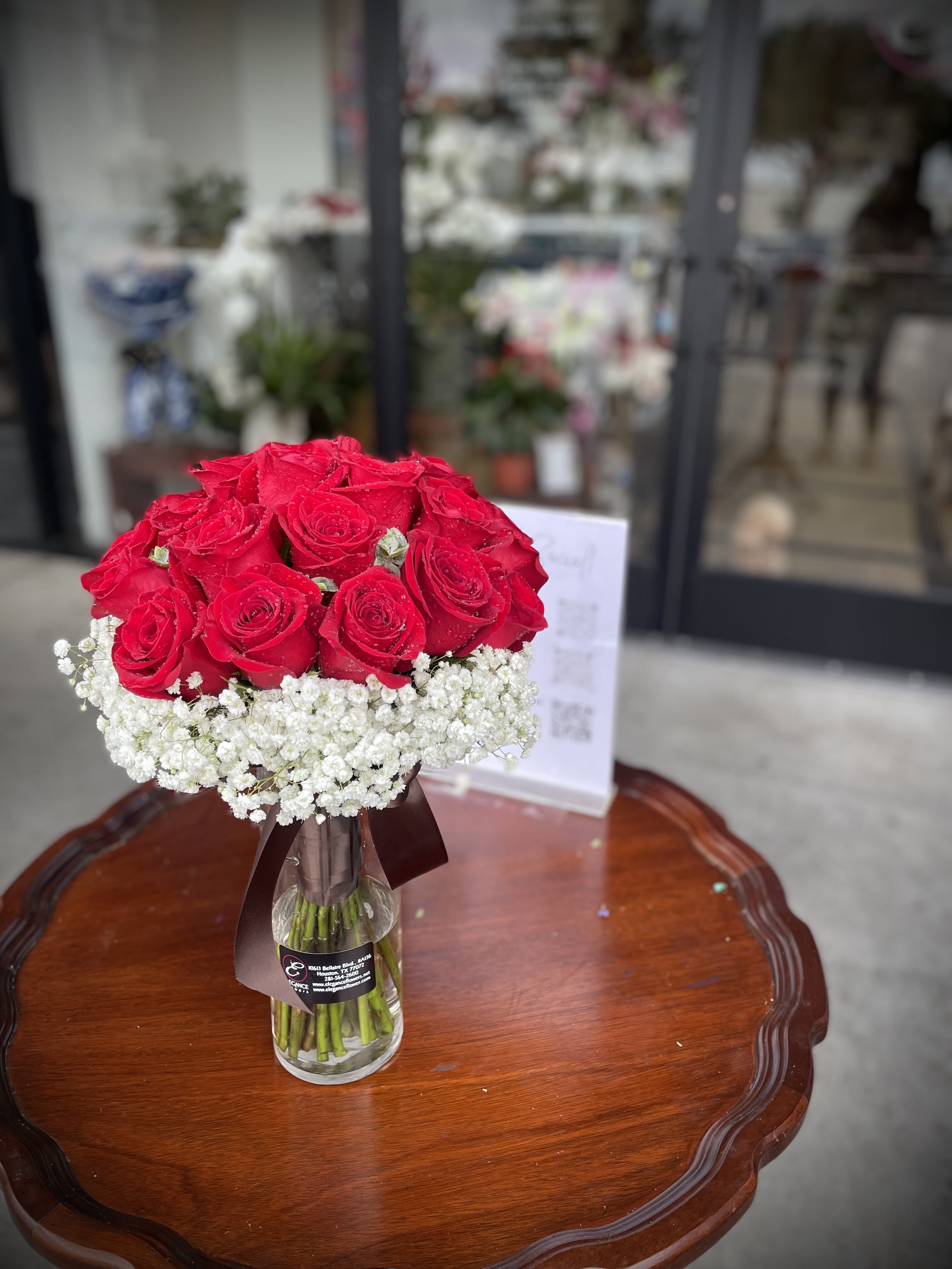 Bridal Bouquet #1 Bridal Bouquet #1 - A classic red rose and baby's breath bouquet is a romantic and elegant hand-tied arrangement, perfect for weddings, proms, debutante balls, anniversaries, and any occasion that celebrates love and beauty.