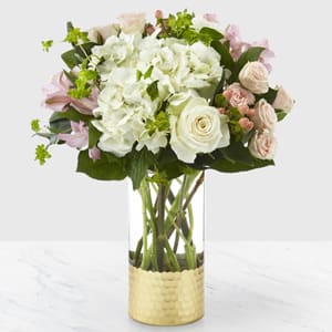 Simply Gorgeous Bouquet - Our Simply Gorgeous Bouquet is a gift they will simply never forget. This fresh bouquet is filled with blushing, beautiful texture and soft pastel hues to complement any message of love. It's handcrafted with spray roses, roses and hydrangea in a shining metallic gold vase for your special people.