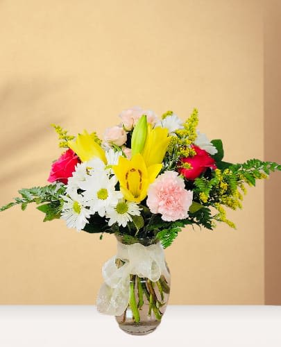 Sunshine Sunshine - This lovely arrangement paired with your special someone, of course! These beautiful blossoms create a picture-perfect pairing of color and texture that will have them smiling from ear to ear.